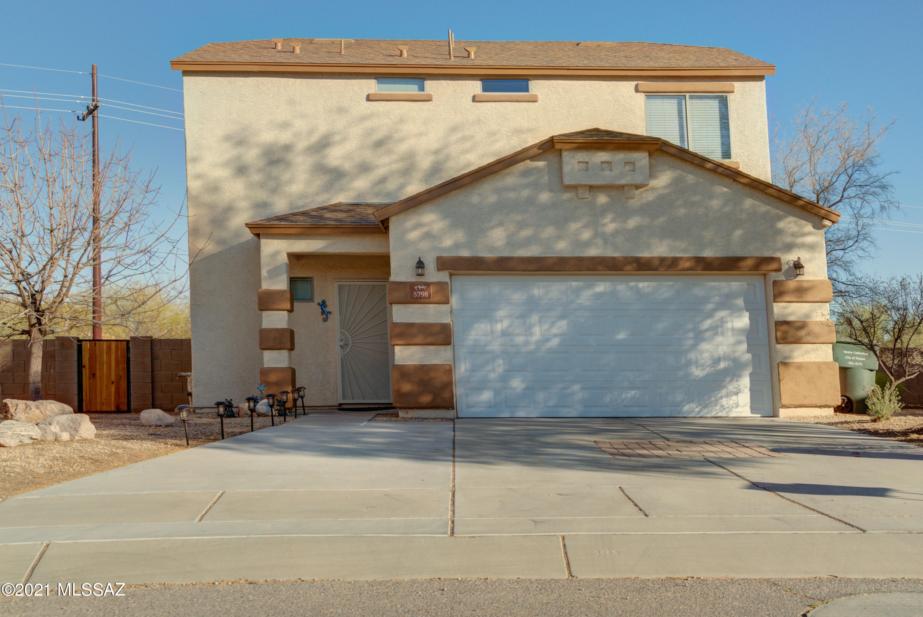 Located on an oversized lot, this 3BD/2.5BA move-in ready home is loaded with extras. Lower level features open floorplan with family room, built in entertainment center & surround sound. Spacious kitchen has SS appliances, breakfast bar, recessed lighting & dining area. Half bath downstairs. Upstairs main bdrm w/walk in shower & large walk in closet, 2 additional bedrooms & second bathroom with shower & tub. Laundry room with front loading washer & dryer. All appliances stay. Encl backyard features covered patio, separate fenced area for pets & covered tikki bar with built in sink & electric. Extras include smart panel, alarm system, keypad entry, 50amp RV plug, water filtration system. Low HOA fees, no neighbors behind. Enjoy nearby neighborhood parks, bike trail & jogging path.