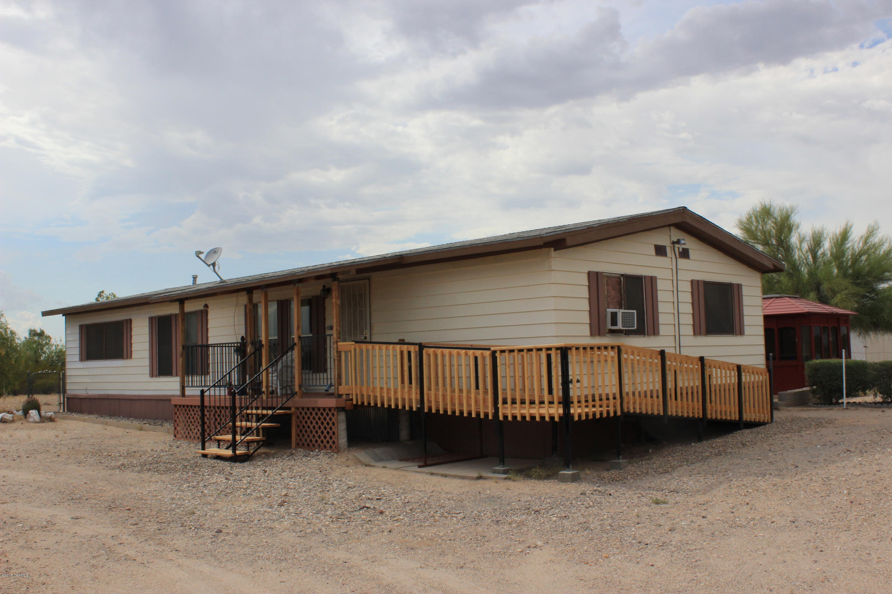 NEW CARPET in this spacious 2bed/2bath manufactured home with extra-large master bedroom. Kitchen opens to family room. New tile in guest bathroom. Lots of storage. Detached workshop with attic. Large shed. Spa house with hot tub. Covered back patio with stamped concrete. Mature trees. Acre lot affords plenty of space for horses, toys, equipment, etc. Adjoining acre lot also for sale: MLS #21428590.