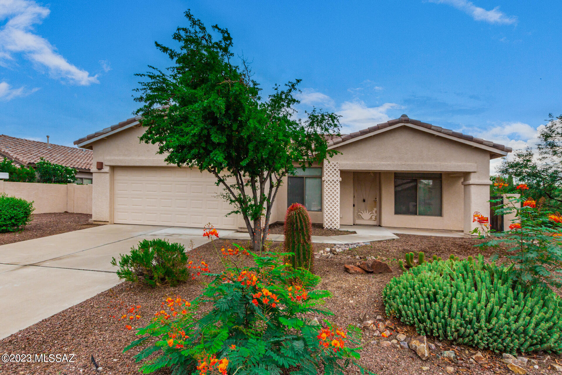 As soon as you enter Monterey Homes at Rancho Vistoso you will realize that this is a special part of the community. Scenic, captivating and gated. Located in the heart of picturesque Oro Valley. This one owner well cared for home is on a premium lot with common areas as a border on west and southwest of the property.  Very light and bright throughout. High ceilings and ceiling fans. All appliances stay.  Natural Gas range. Sharp screened in back patio done right for your comfort.  Separate living and dining area as you enter with a family room off the kitchen.  Bay window in master. Kitchen has a breakfast nook and breakfast bar. Bonus utility room with sink off garage. A truly beautiful and lush desert location. Great shopping and recreation all nearby. A truly lovely setting