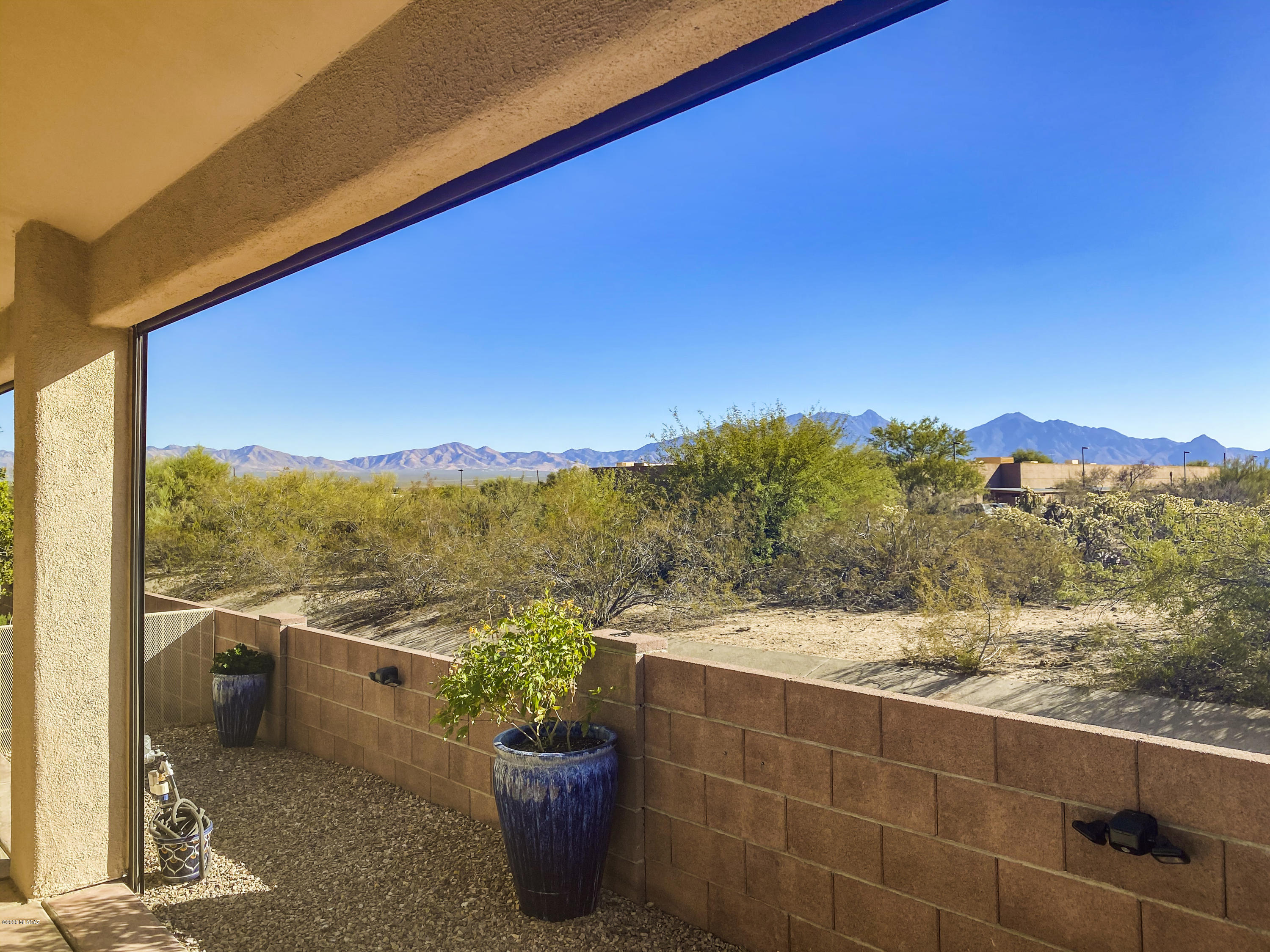 A lovely ''Bright Star'' model that will fit all the check boxes on your wish list!  Step inside to find attractive desert tone tile flooring throughout the main areas and lovely plank flooring in the bedrooms.  This efficient layout has two bedrooms, 2 baths, a den with skylight providing great natural light, high ceilings and a gas corner fireplace in the great room.  The gorgeous kitchen has bright white cabinetry with contrasting countertops, stainless appliances and a window over the kitchen sink providing views of natural desert.  You'll love spending time on the private patio with remote sunscreens as you relish the views of the desert and a peak of the mountains in the background.  The Canyon View community offers a clubhouse, pool and many activities for its residents and membersh to Green Vallely Recreation is optional.  Come take a look  you won't be disappointed!