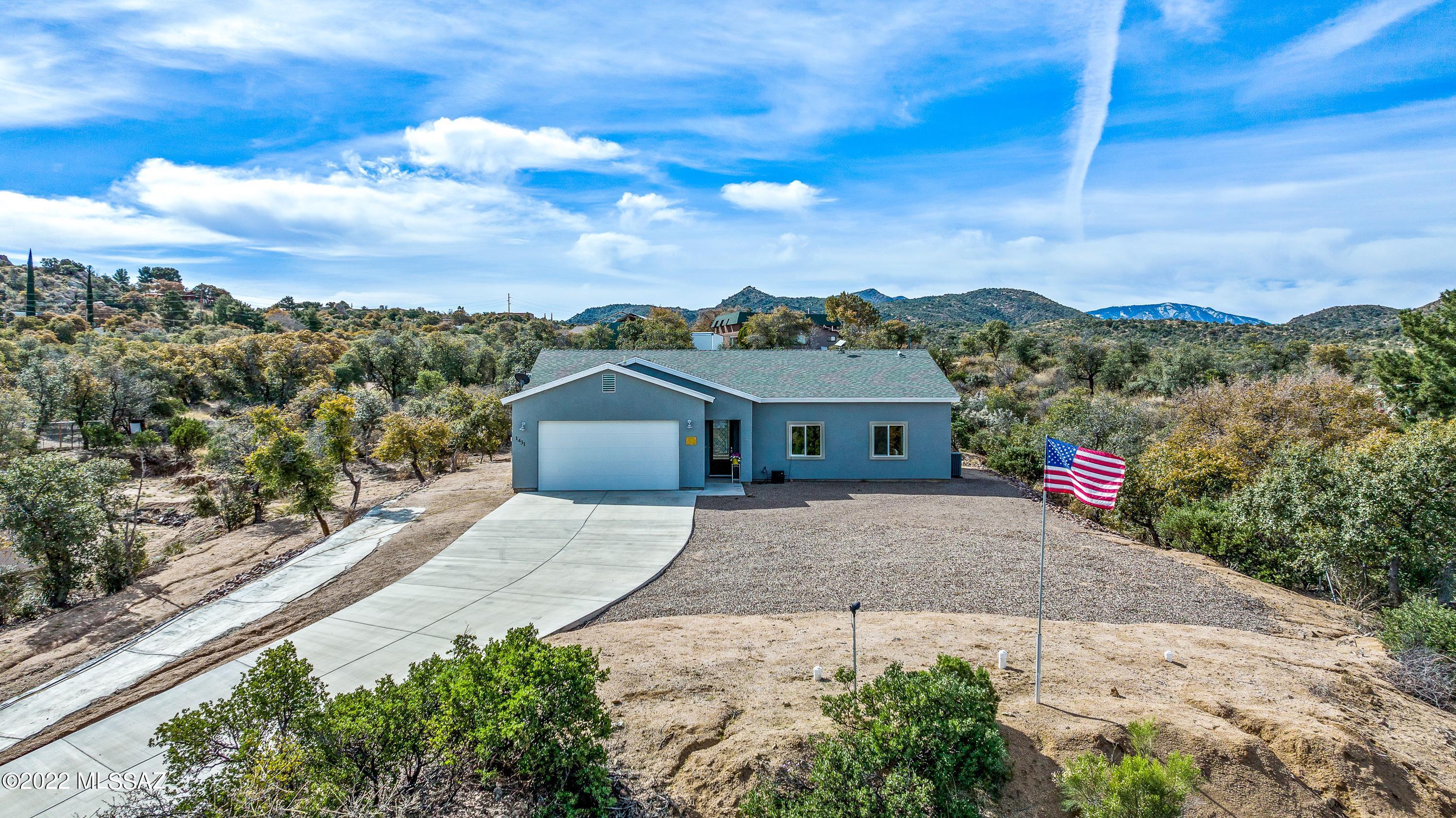 Welcome to this fantastic 2020 constructed home located off the desirable neighborhood of Cody Loop Road. This beauty sits perched in a gorgeous cul-du-sac with oak trees, lush greenery & spectacular mountain views! You'll love the bright open concept with 10 ft ceiling and recessed LED lighting. Wait until you see this great kitchen with granite countertops, solid custom wood cabinets, and a large island for the whole family to gather around. Open the back patio doors to your extended covered porch, fenced in yard, & don't forgot the hottub that stays for the new owners to enjoy. Attached 2 car garage & room to park your RV! Hundreds of miles of hiking & adventures to explore right from your front door. Nothing to do, just move right in & start enjoying high mountain living at it finest!
