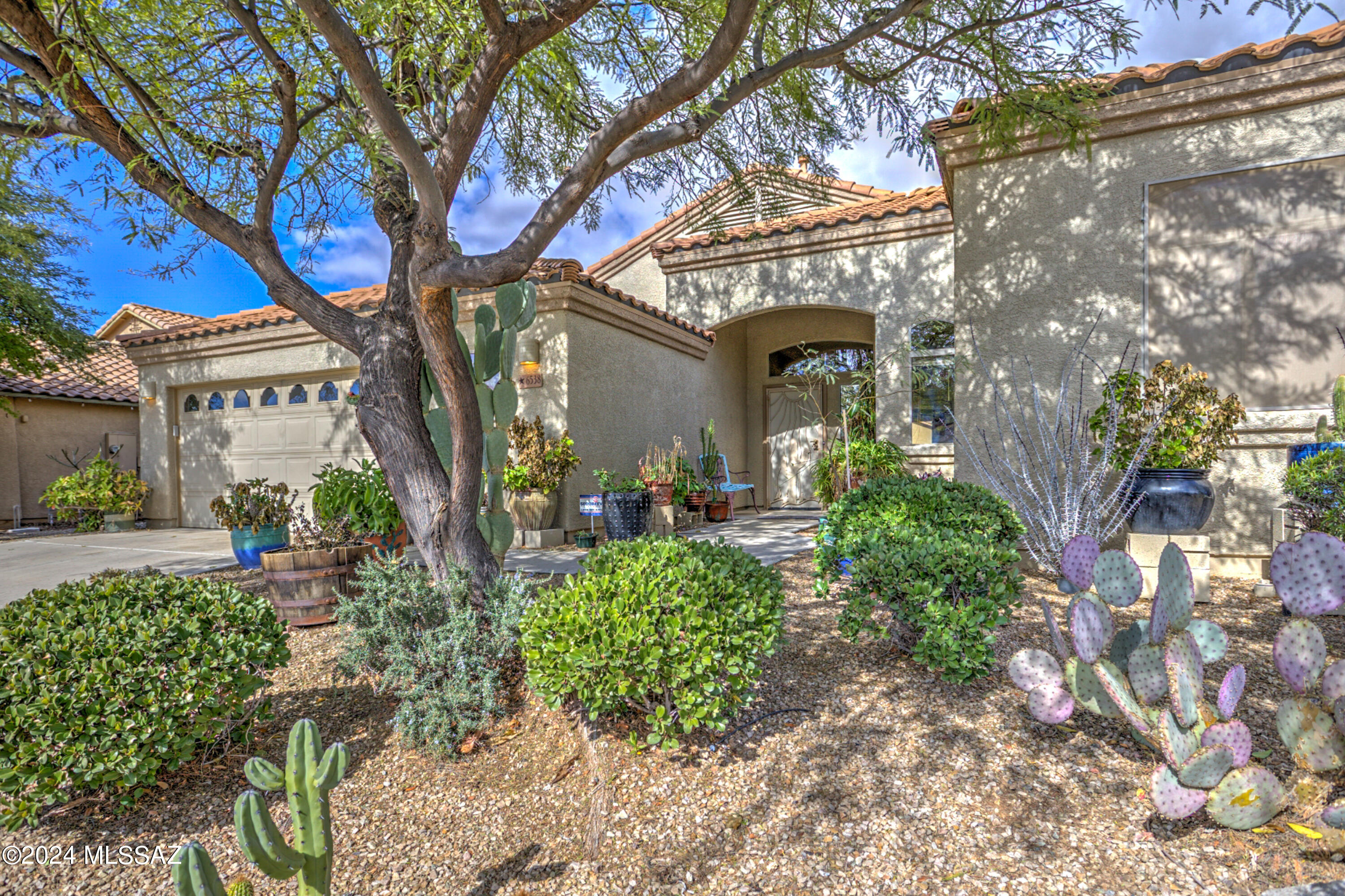 This amazing house offers a split floorplan and open living space. Large great room has space for everything and is open to the kitchen. All of the appliances are included. Kitchen island with the sink, dishwasher, and a breakfast bar countertop. Stay organized with lots of extra built-in cabinets in the kitchen, bathrooms, and the laundry room. Backyard oasis features a peaceful pond with waterfall feature, 4 fruit trees (2 orange, 1 lemon, 1 tangerine), full length  covered patio, and a higher elevation then the house behind you for extra privacy.  2.5 car garage with a window and a door to the side yard. All of the appliances are included and the mounted big screen TV in the Livingroom. Prewired surround sound speakers & a doggie door in the Livingroom. 3 custom wrought iron doors.