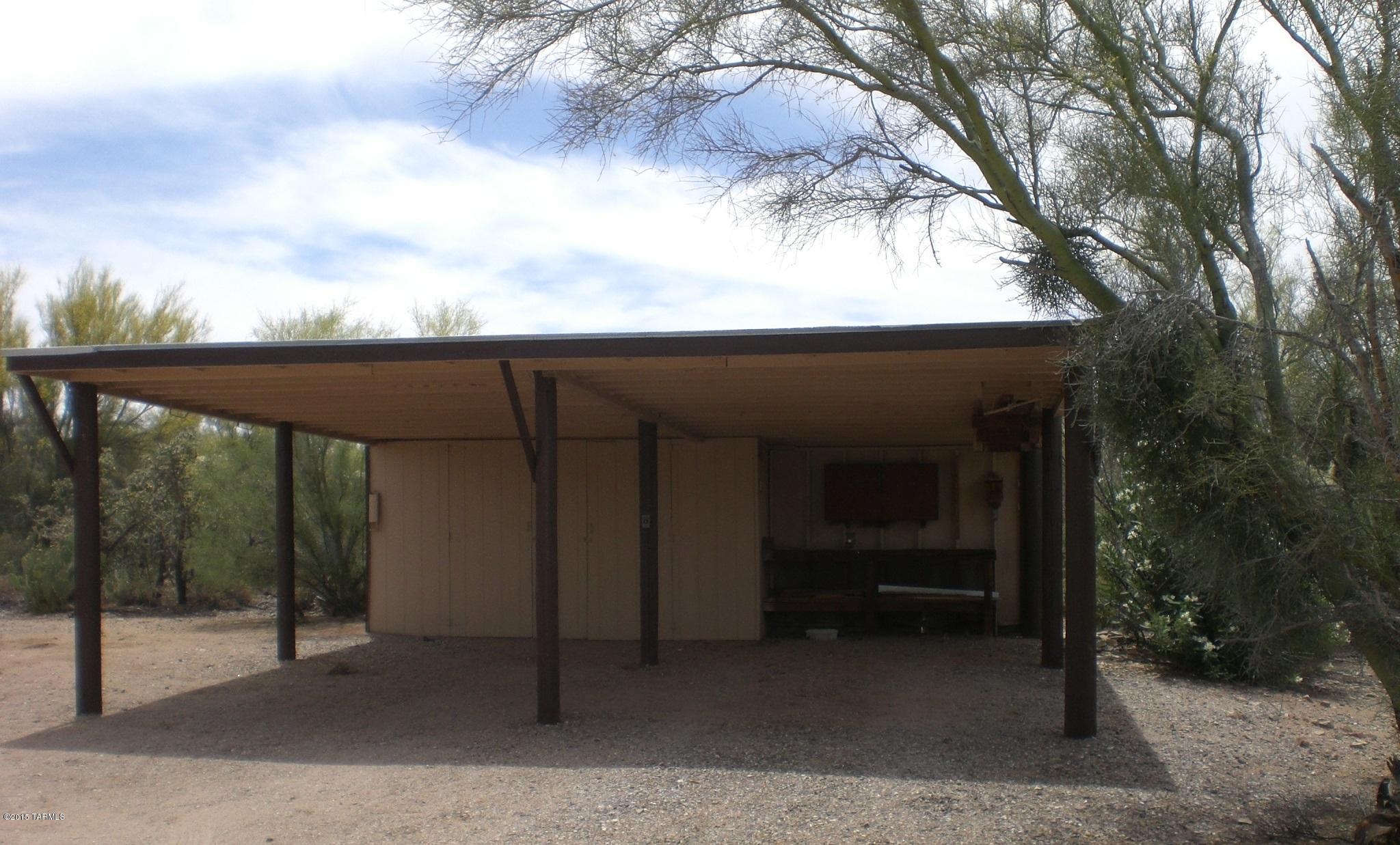 Welcome home to this affixed manufactured home on just over 4 acres! Imagine the possibilities! Featuring a 3 bedroom 2 full bath split bedroom plan. Fireplace, screen porch, covered patios front and back. Storage shed, dog run or garden area fully fenced to keep the friendly wildlife out, carport with additional storage and outdoor workbench. Solid home just needs a bit of updating, what new flooring and tape and texture would do for this gem!
