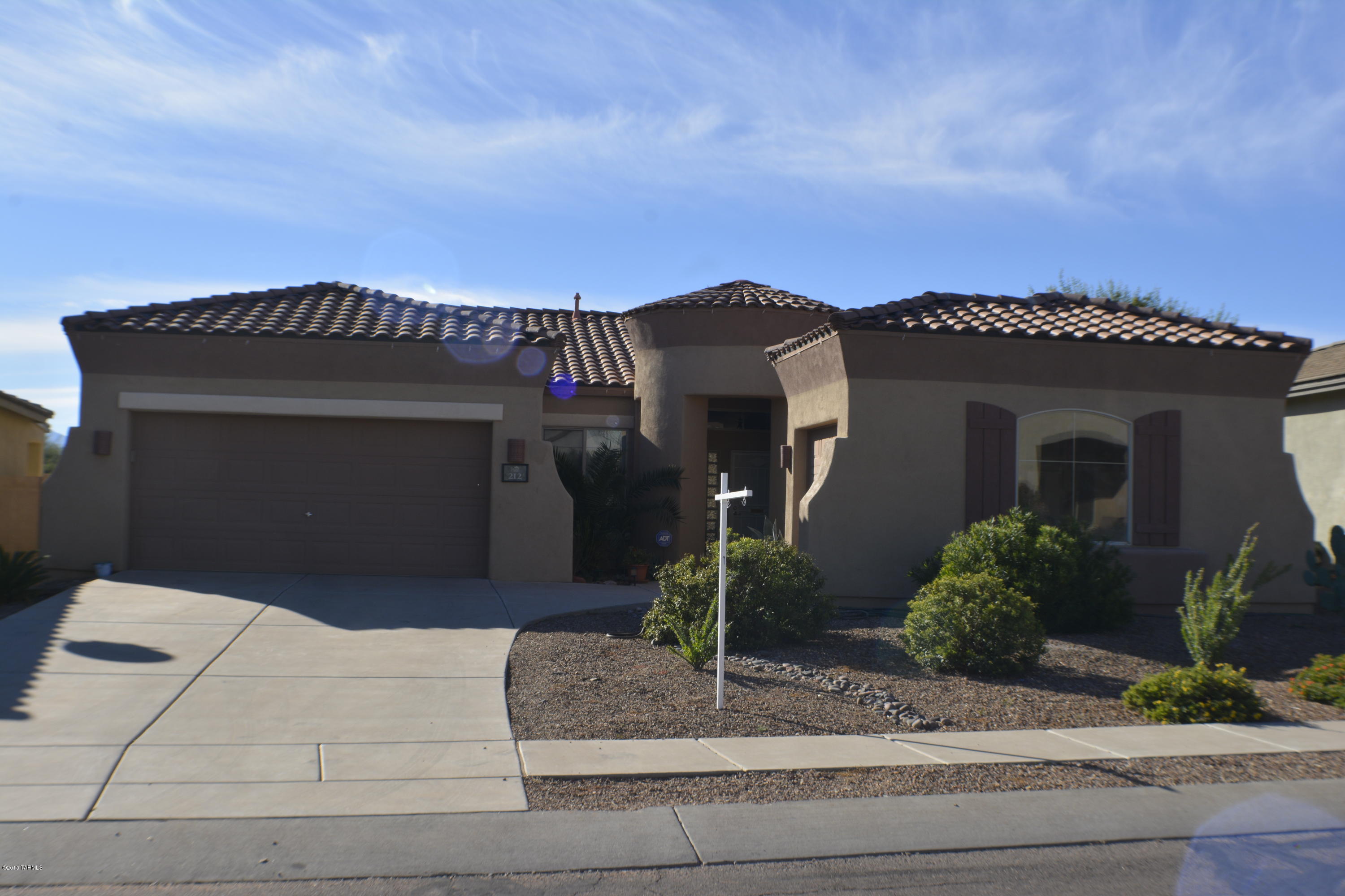 Wonderful single level home located in award winning Rancho Sahuarita. The open floor plan with soaring 10 feet ceiling is a great place to gather with family, friends, and neighbors. SS/black appliances come with the home as well as tile throughout with exception to 2 bedrooms with new carpet. This freshly painted home offers 3 bedroom, 2 full bath split floor-plan that has a very spacious master suite complete with a garden tub, separate shower, executive height double vanity, walk-in closet, and private sliding glass door that gives you access to your own oasis complete with your own private pool. This is backyard living at its best whether you're taking a dip in the pool or gathering in front of your outdoor fireplace.  
Call this beauty your home for the Holidays!!