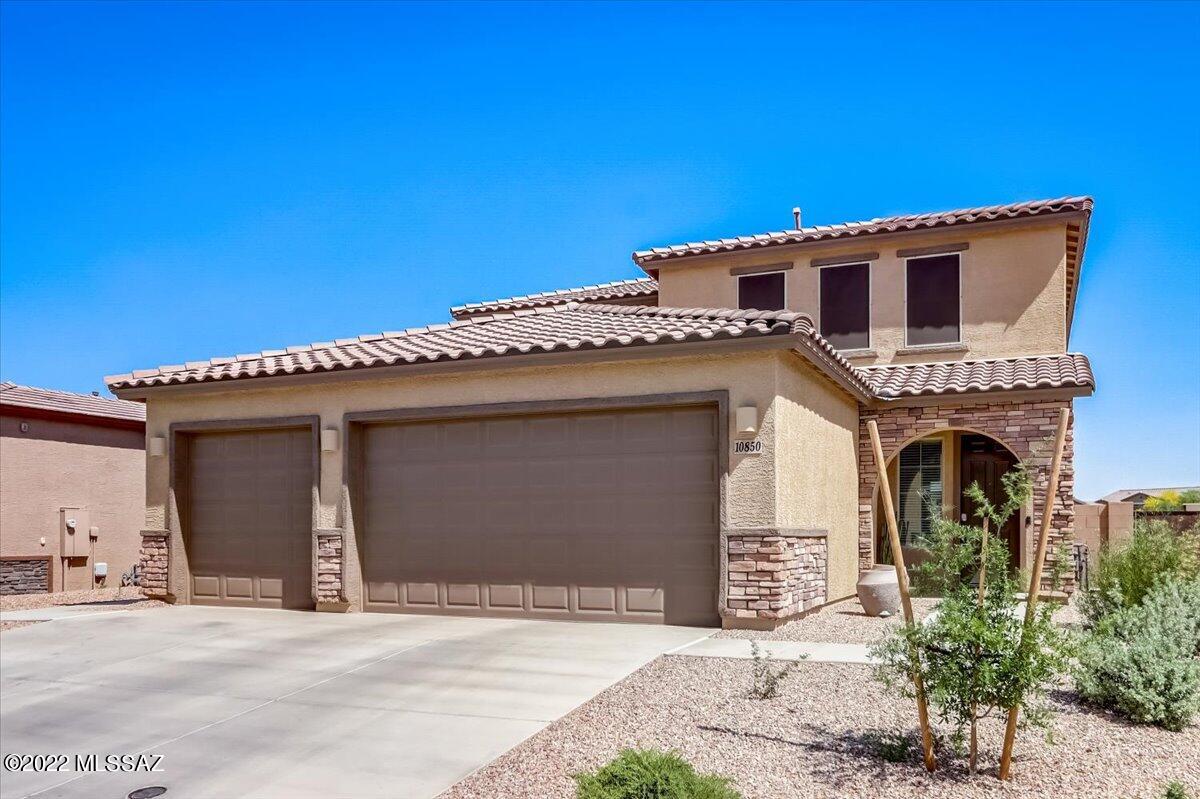 A Home within a Home, attached separate Guest House.  Generational living at its best in Gladden Farms.  As you walk into the main Home, you are greeted by woodgrain tile throughout, bright and open spaces and a contemporary kitchen with dual ovens, SS appliances, grey cabinets and granite countertops. Upstairs you will find large secondary bedrooms, laundry room and a massive Primary suite. The Primary bathroom offers a huge walk-in shower, dual sinks and plenty of room in the walk-in closet.  The GUEST HOME has it's own private entrance and secondary entrance into the main Home.  A full kitchenette with full sized refrigerator, granite countertops, Living room, separate bedroom and bath, plus it's own W/D hookups