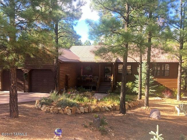 Nice landscaping giving a great curb appeal.  Great room with a gas floor to ceiling stone fireplace, custom TV cabinet, accent painted walls,  T&G wood ceilings & wood laminate flooring throughout the living areas. Plantation shutters throughout. Kitchen features a breakfast bar that seats 3, stainless steel appliances, Hi-Mac counter top, tile back splash and corner pantry. Charming dining area with elk chandelier.  Master bedroom with nice sized bath, his and her closets and a slider to the back. Large covered front & back deck. Some furniture is available outside of escrow.