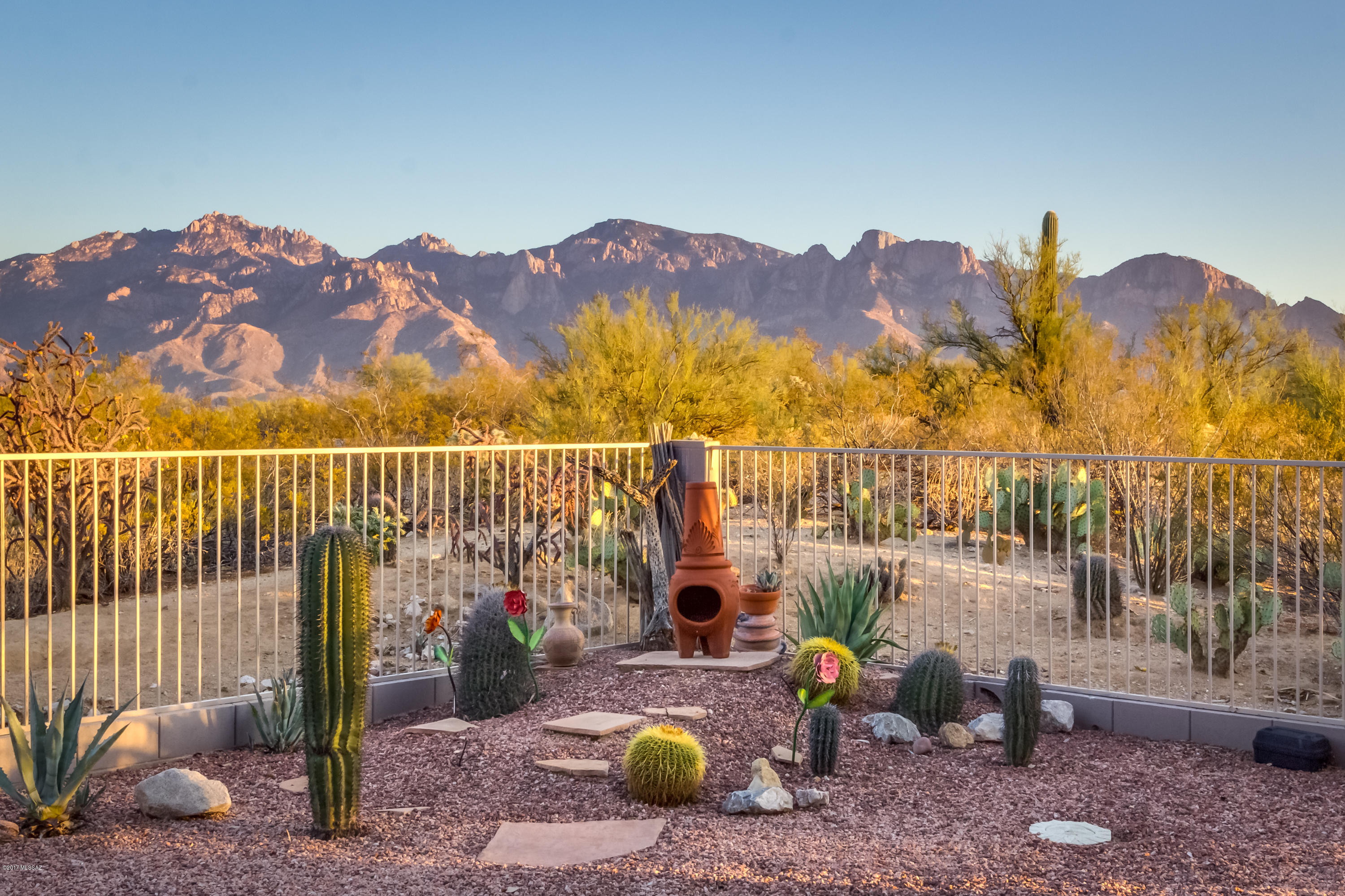 Gated Monterey at Vistoso- 1 story 3BR/2BA+den - private cul-de-sac premium view lot-no homes behind overlooking Honey Bee Park & Catalina Mountain unobstructed view. 2011 Kitchen remodel w/Quarter Sawn Oak Cabinets w/Pecan finish w/pull-outs, Granite counters, GE & Frigidaire appliances, pantry, breakfast bar. Family room off kitchen has fireplace. Formal Living/Dining area. Newer modern ceramic tile, newer carpet in MB. Master suite 2014 bath remodel w/new cherry wood cabinetry w/oak finish, Silestone counters, walk-in shower & walk-in closet. Enjoy east-facing patio w/mountain views from private backyard w/extended covered patio, Flagstone, Spool, Kiva wrought iron fence. Front security door. 3 car garage. Original owner, well-maintained, used as 2nd home. Furnishings negotiable.
