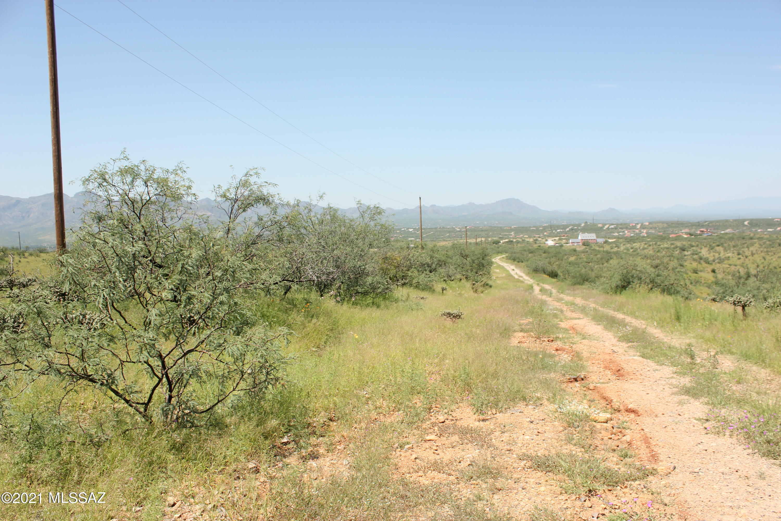 Remote area, few neighbors close.  The road will be better maintained by the county once someone builds a home on this road.  Downhill slope great views.