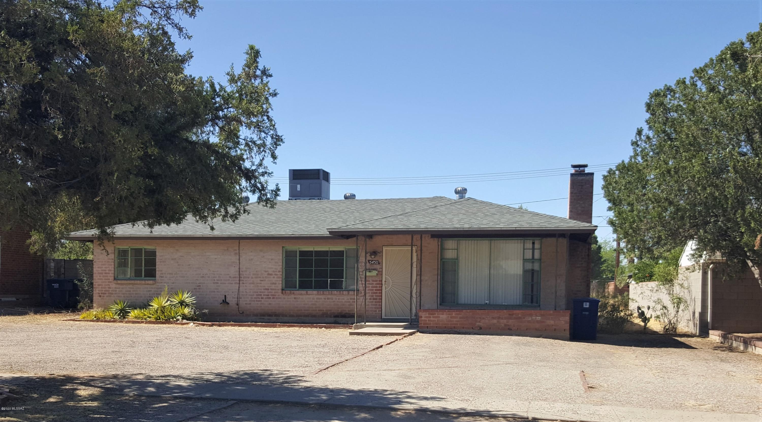 Nice Brick home in central area on large lot, updated kitchen, tile in all areas but master, 3 bedroom, 2 bath or 2 bedroom w/den, nice cozy fireplace, fresh paint, light tone colors thru out, large rear yard, carport in rear of home, lot goes beyond block wall fence.  NO HOA!  Come see!