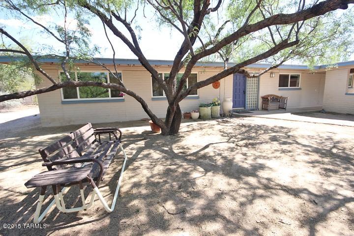 TAKE A LOOK AT THIS FRESHLY PAINTED adobe sweetheart on 1+ mesquite studded acre boasts updated kitchen with granite counters, double oven, ceramic cooktop, storage galore incl. 3 lazy Susans, wood cabs with slideouts.  Skylights/solar tube. NO carpet-just tile and laminate floors. TWO master suites. TOP of line HVAC system 16 seer 11/2014 costing $10K. Fans, paneled doors. Roof maintained every year! Electrical upgraded in 2005. LOW E dual pane windows w/dead bolts. Cul de sac. Over carport storage plus shed in rear yard. Wrought iron enclosed POOL and playset. VIEWS. Excelling schools!