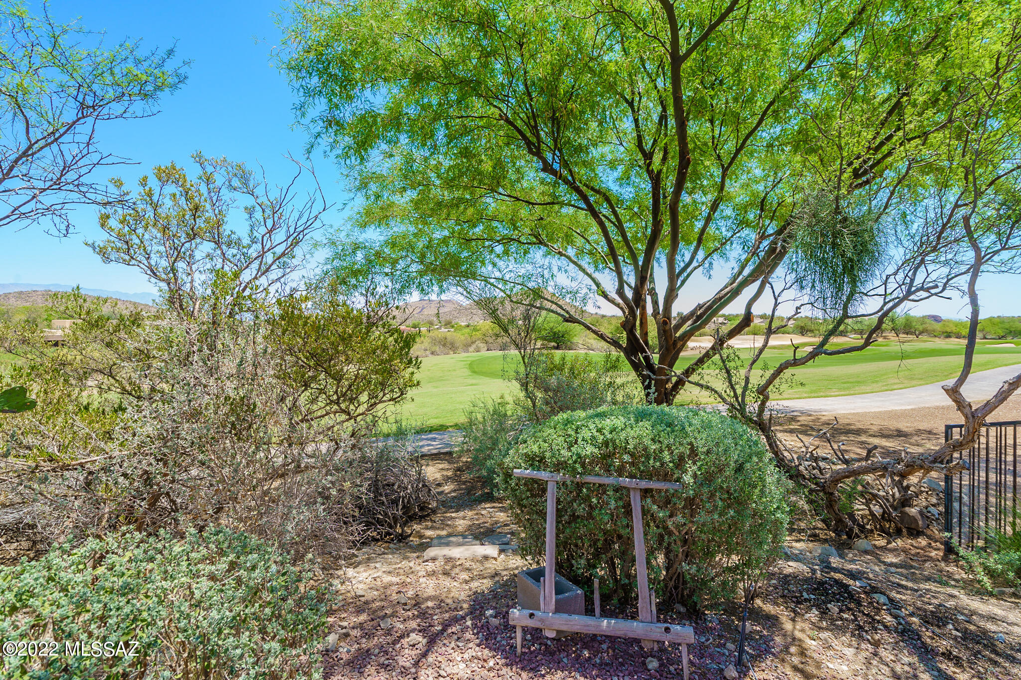 WELCOME TO STARR PASS and the coveted small community of Deer Crossing. Only 29 homes tucked away in this charming sub-development. THE SPECIAL SURPRISE w/ this home is GOLF Course views, Incredible Mountain views, located at the end of cul-de-sac w/ a stunning landscaped yard & access to the golf course right out your pack gate. This home has been loved. Roof was completely replaced several years ago with 1 year remaining still on warranty. 3-Bedrooms, 2-Baths, Large Great Room w/ FP, Solar screens for all windows Plus custom Wrought iron for windows and front door. Lock & Leave. High ceilings for that true OPEN FEEL. One bedroom has built in office desk & murphy bed. Homes almost never come on in this community - so hurry over and visit this TRULY AMAZING HOME.