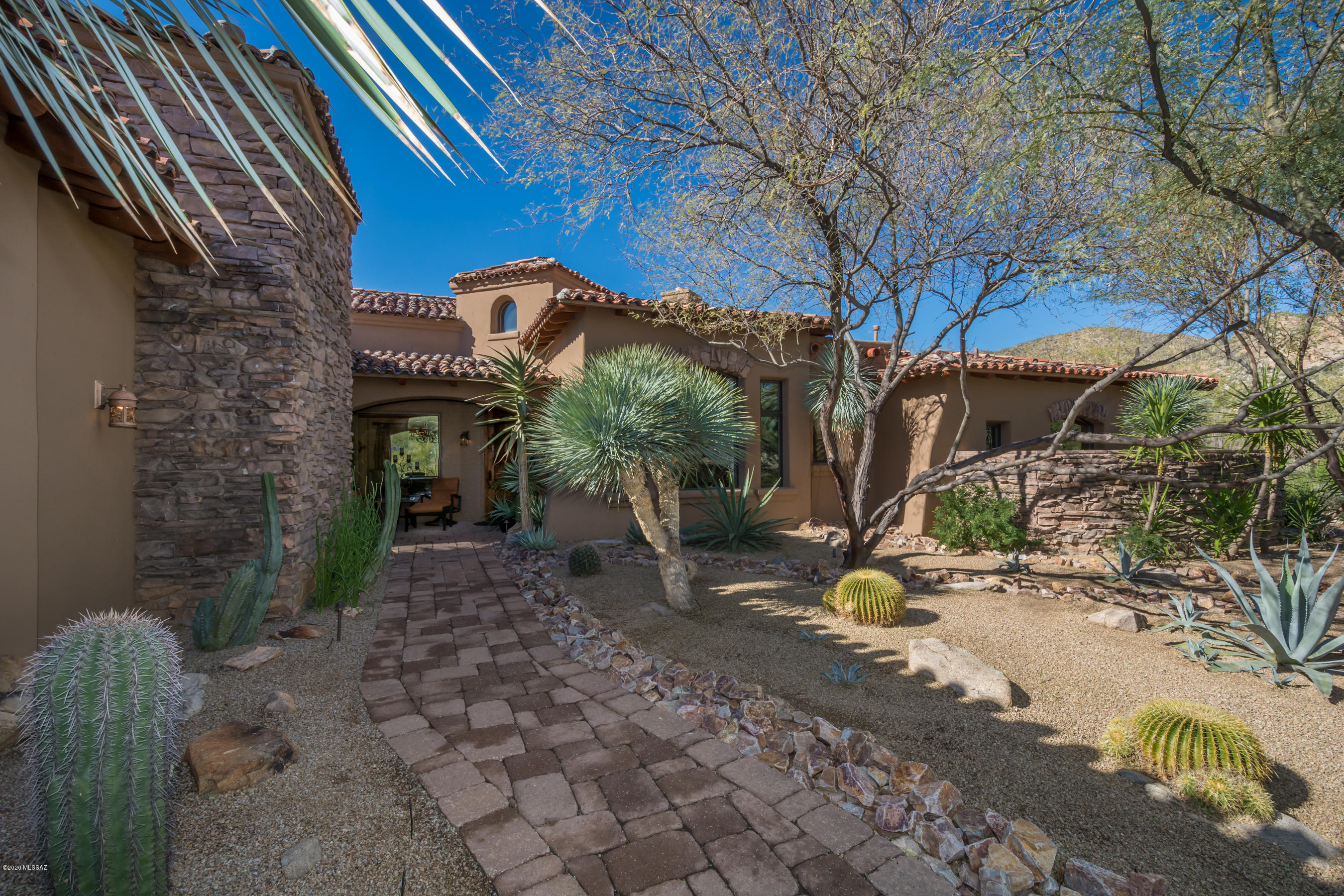 Amazing privacy and tranquility at the base of the Tortolita Mountains with large conservation areas in front and behind the property.  One of the best values in Stone Canyon and priced below market. Open concept kitchen/great room. 15 foot ceilings, 3 large bedrooms plus den, 4 full baths. Private patios off all bedrooms. Viking appliances. Travertine floors. Granite throughout. Pool and spa. Masonry block construction.  Furnishings negotiable for virtually turnkey opportunity.  Owner is licensed real estate agent in Arizona.