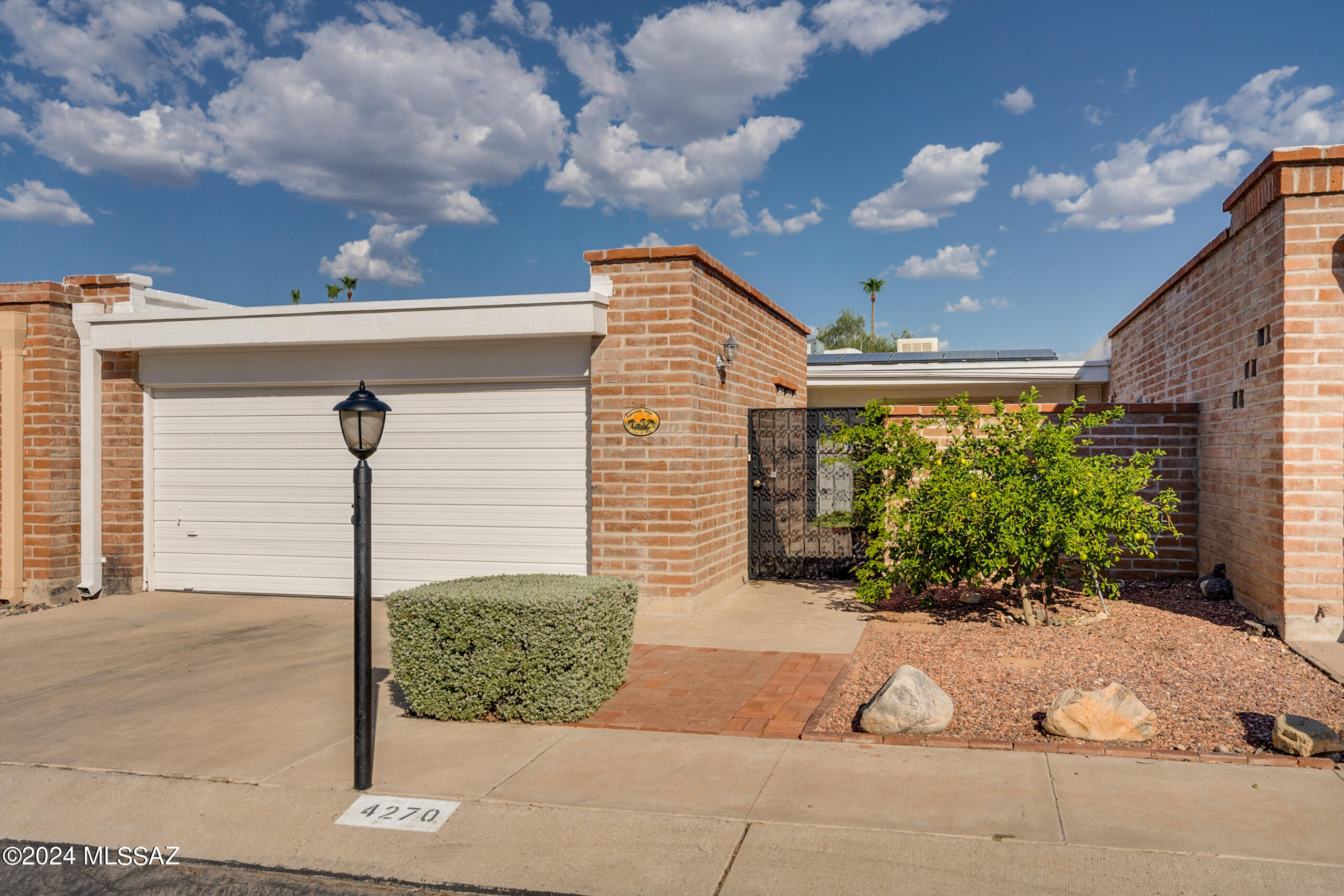 This move-in-ready townhome, offers a perfect combination of charm, comfort  and convenience. 2-bedroom, 2-bathroom home features a spacious den with a cozy brick fireplace. The flexible layout allows the large master bedroom to be closed off as a separate suite for privacy, while the second bedroom overlooks the gated front patio, ideal for relaxation.

The eat-in kitchen offers a view of the patio and includes a handy nook with a washer, dryer, and extra storage space. A screened-in back porch allows for extra entertainment.

Located near a park, restaurants, and Tucson Mall, and offering stunning mountain views, this home is a fantastic opportunity for anyone looking for comfort and convenience in Tucson.
