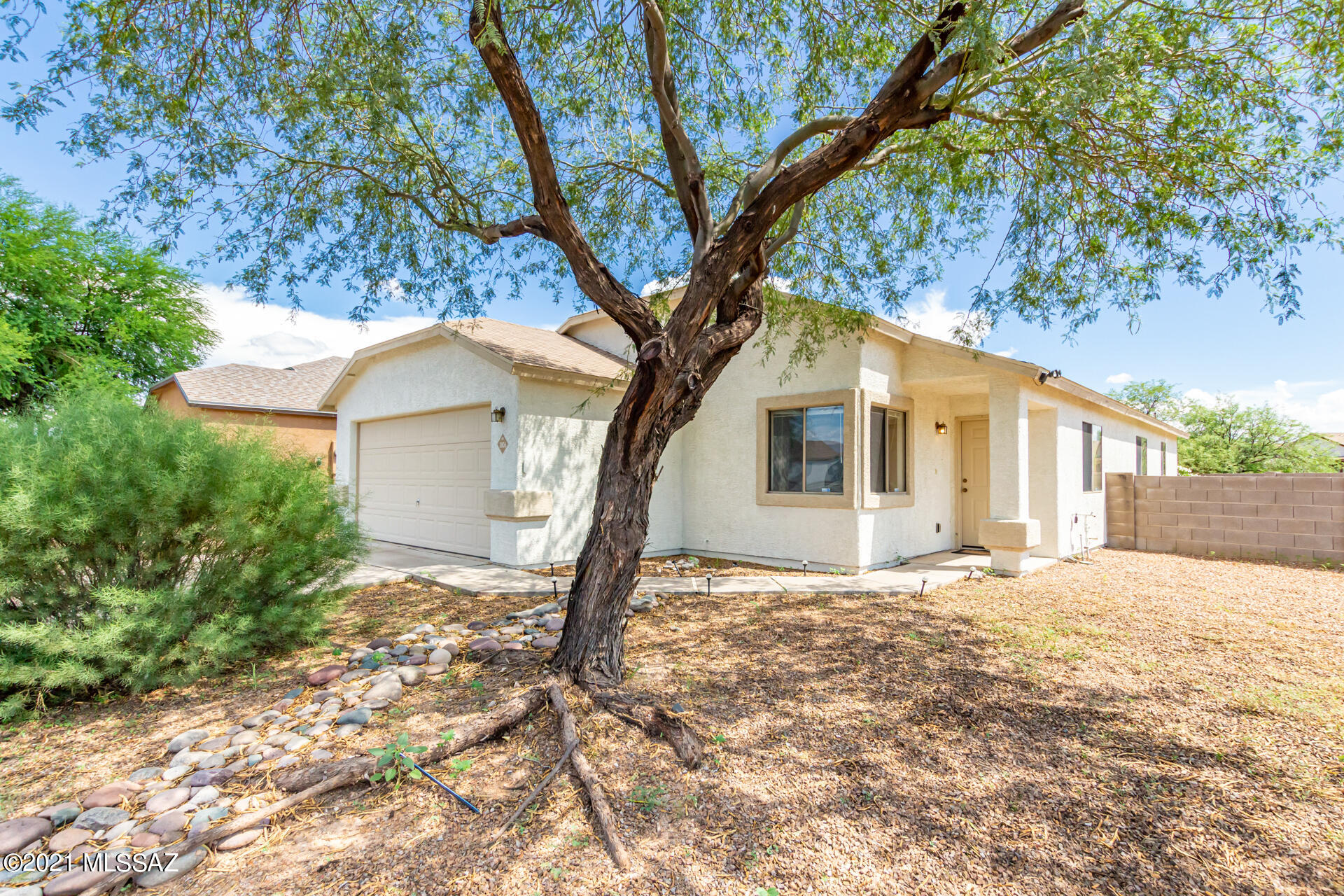 Move in ready home with ceramic tile and laminate wood floors everywhere except the master bedroom. Large eat in kitchen & family room with an island, tons of counter space and plenty of storage. One of the largest lots in the subdivision with only one neighbor. Two car garage, laundry room with washer & dryer included. Make this home today!