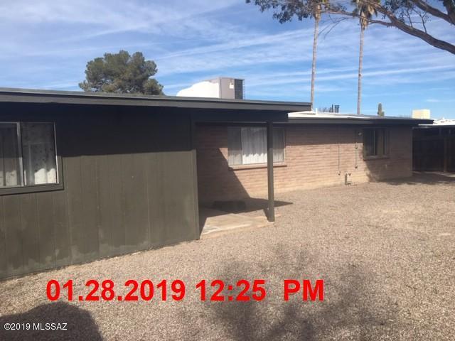Totally updated home with solid maple cabinets, granite counters, SS appliances and 20x20 porcelain tile in the kitchen, family room and laundry.  Both baths have travertine floors and marble surrounds with quartz counters.  The living and dining areas have solid rustic oak flooring.  Ceiling fans in master, family room and AZ room.  There are custom metal gates on each side of the home for easy backyard access.  Garage has space for a workshop area.  This property may qualify for seller financing, ''Vendee''.