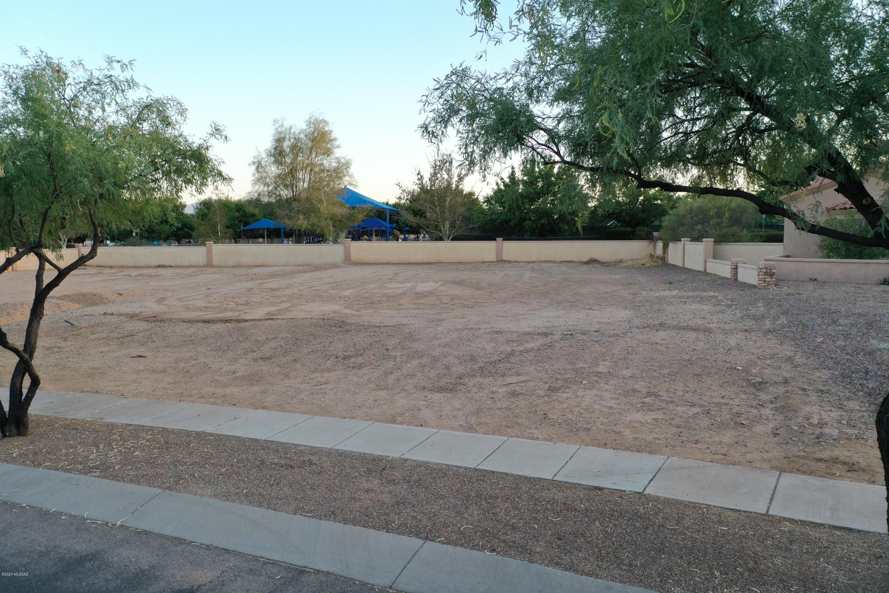 This is your only opportunity to bring the custom builder of your choice to build your dream home in Rancho Sahuarita! One of only 4 available lots in this exclusive gated lakeside neighborhood. All utilities at the lot line and ready to be built on. We can connect you with an architect who has 4 approved luxury floorplans by the Town of Sahuarita, or you can work with your own architect.