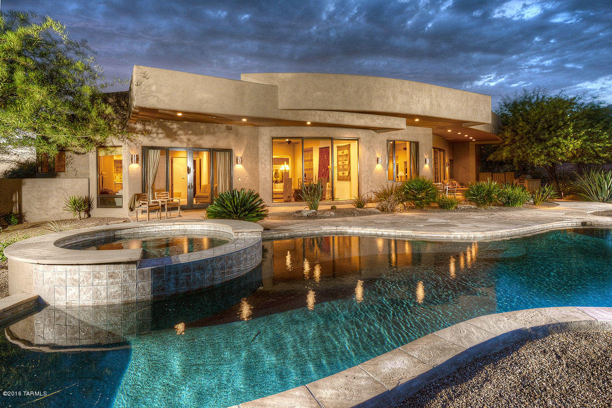 UNBELIEVABLE DEAL! Seller willing to take a big loss at this price! Turn Key Gated Resort Luxury Custom Home on 16th hole of The Gallery's North Course in Dove Mtn. Casual yet elegant w/ great room concept & wall to wall windows bringing in dramatic views. All 4 bedrooms have in-suite baths. Top of the line quality finishes w/ warm natural stone, maple floors, Viking appliances, 42'' alder cabinets, 4 fireplaces, energy saving windows & doors, complete home theater, 600+ wine cellar, brand new One-Touch salt water system for pool & spa. Spectacular views from several private patios, outdoor kiva fireplace w/ built in seating, built in BBQ, deep covered patios for dining al fresco & shaded lounging poolside,  Large 3 car garage w/ extra storage rm.  Beautifully furnished & waiting for you!