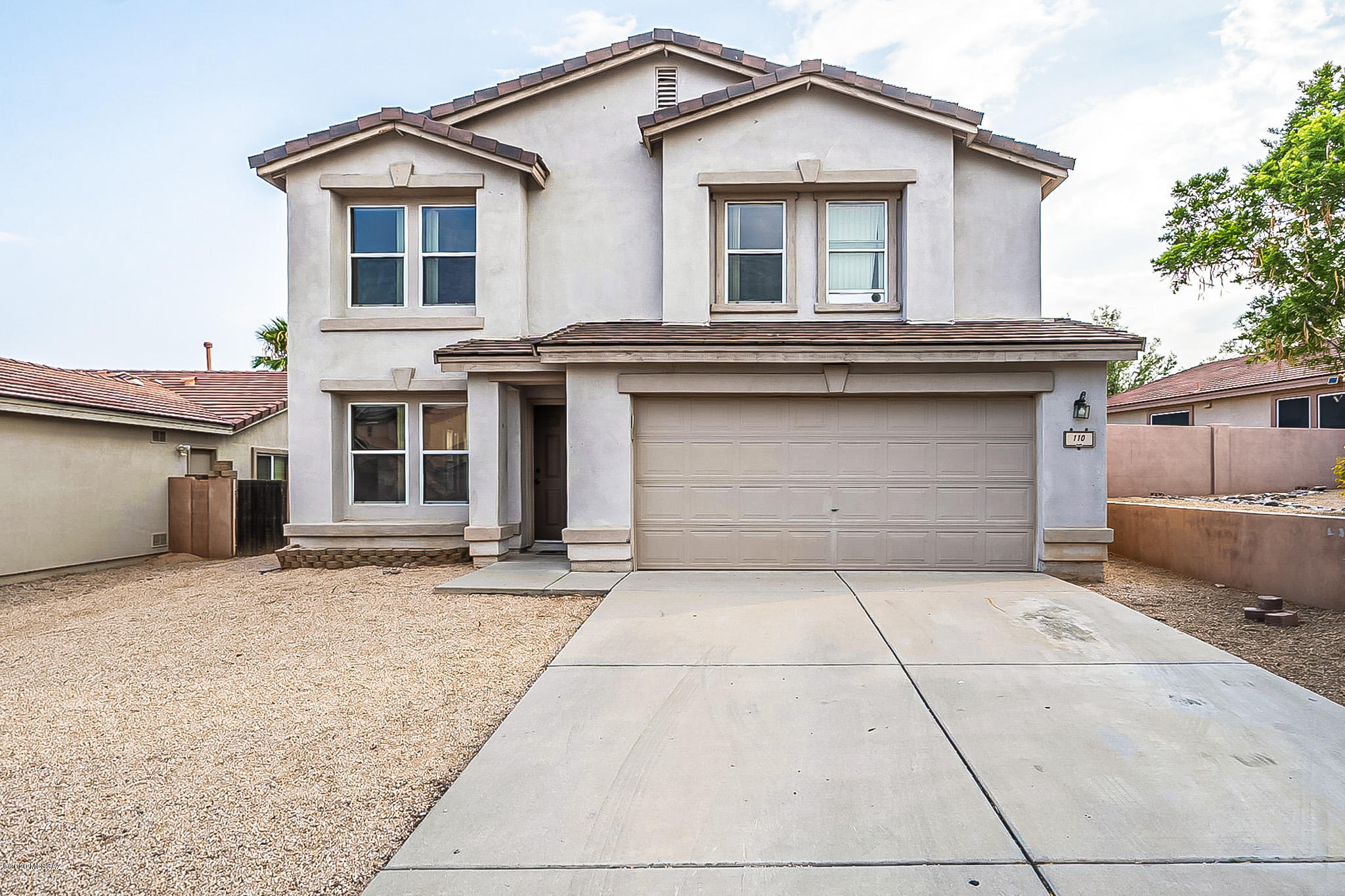Welcome home to this spacious 4 bed, 3 bath in coveted Rancho Sahuarita! The open floor plan concept  allows for ample room for entertaining and dining, while the 2nd floor loft has endless possibilities, creating space for an office, playroom, exercise room or entertainment area. 2nd floor Bathrooms have been recently renovated, and the home has newer carpet and interior paint. Natural light pours through countless windows creating a bright and airy living space. 
The roomy back yard is an entertainer's delight, while the extended tandem garage provides abundant storage and space for 3 vehicles, an in home gym or massive hobby area. This home features almost 2800 square feet, is steps away from the well maintained community park, and will NOT last long. Must SEE!