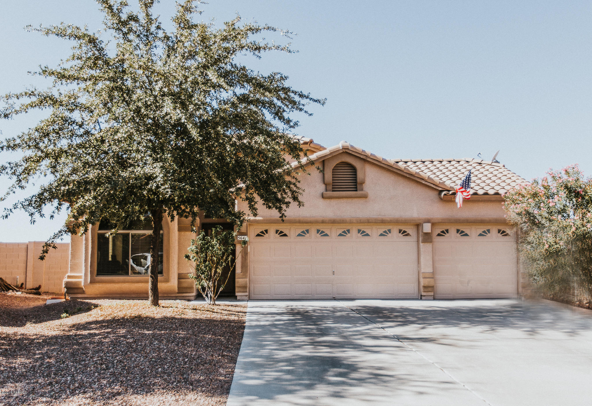 PRICE REDUCED! Beautifully upgraded home on a premium lot in the highly sought after Cortaro Ranch subdivision. Easy access to freeway! Three large bedrooms/2 full baths with gorgeous tile surround. Granite counter tops in kitchen with an oversized island with storage and electrical. Additional breakfast counter. The whole house is tiled with tile baseboards. Fully landscaped backyard with extended stained concrete patio, seating areas, and artificial turf for your use to enjoy the views of Sombrero Peak. There is an additional sideyard being used as a dog run. Electrical upgrades in backyard and garage. Garage is a dream with extra outlets, ceiling fans and is cable ready! This house is a well maintained gem! Come and see it today!See more under document