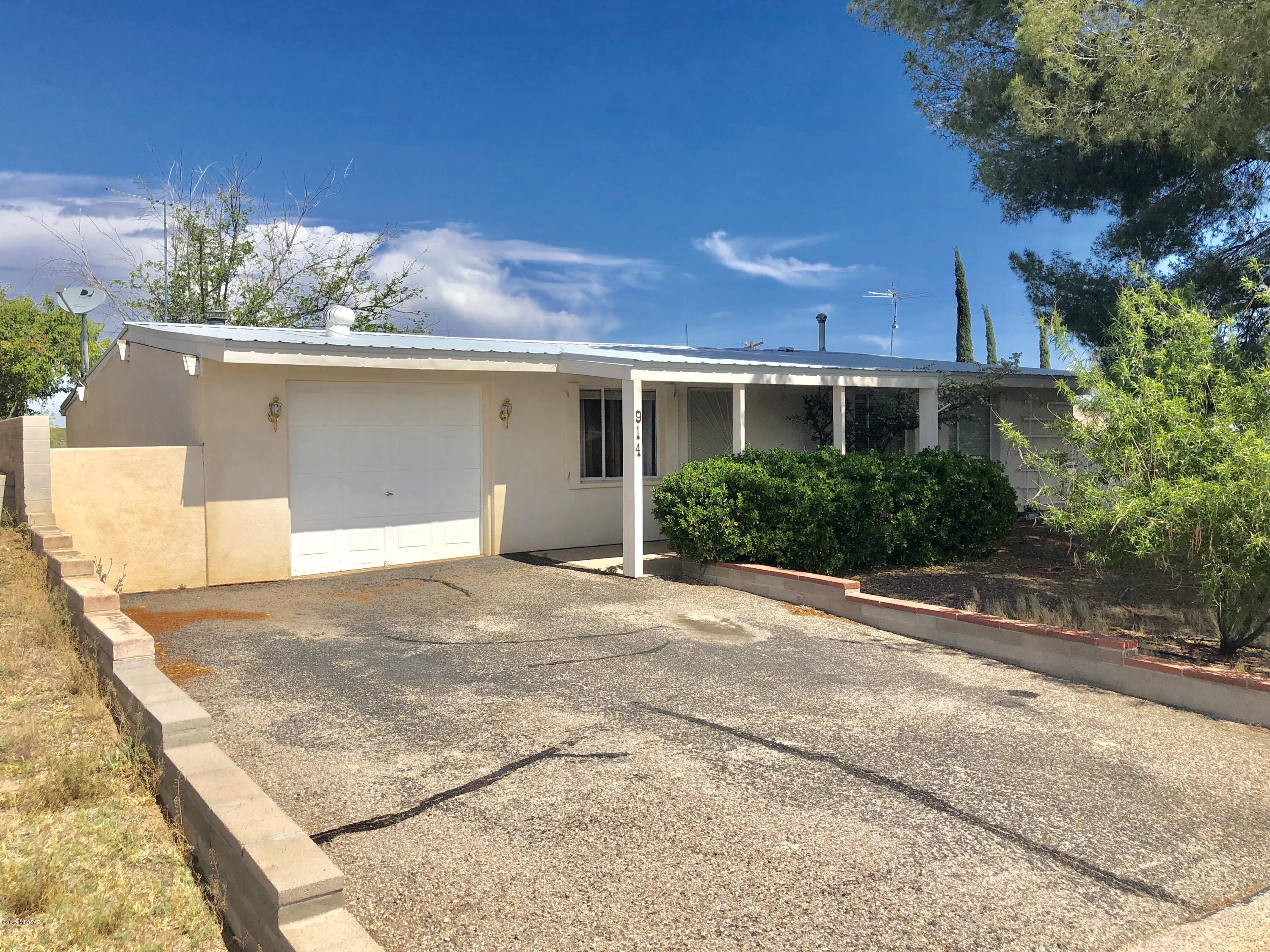 Well-maintained 3-bed 1-bath home with central A/C, available to rent July 1st! Interior features a remodeled kitchen and bathroom, a large living room with fireplace, interior laundry hook-ups, and a 1 car garage. The large backyard faces the desert for incredible sunsets, and has lots of room for storage or hobbies such as gardening!

Please text 520-490-5232 with property address and your email to schedule a showing and for application / deposit info.