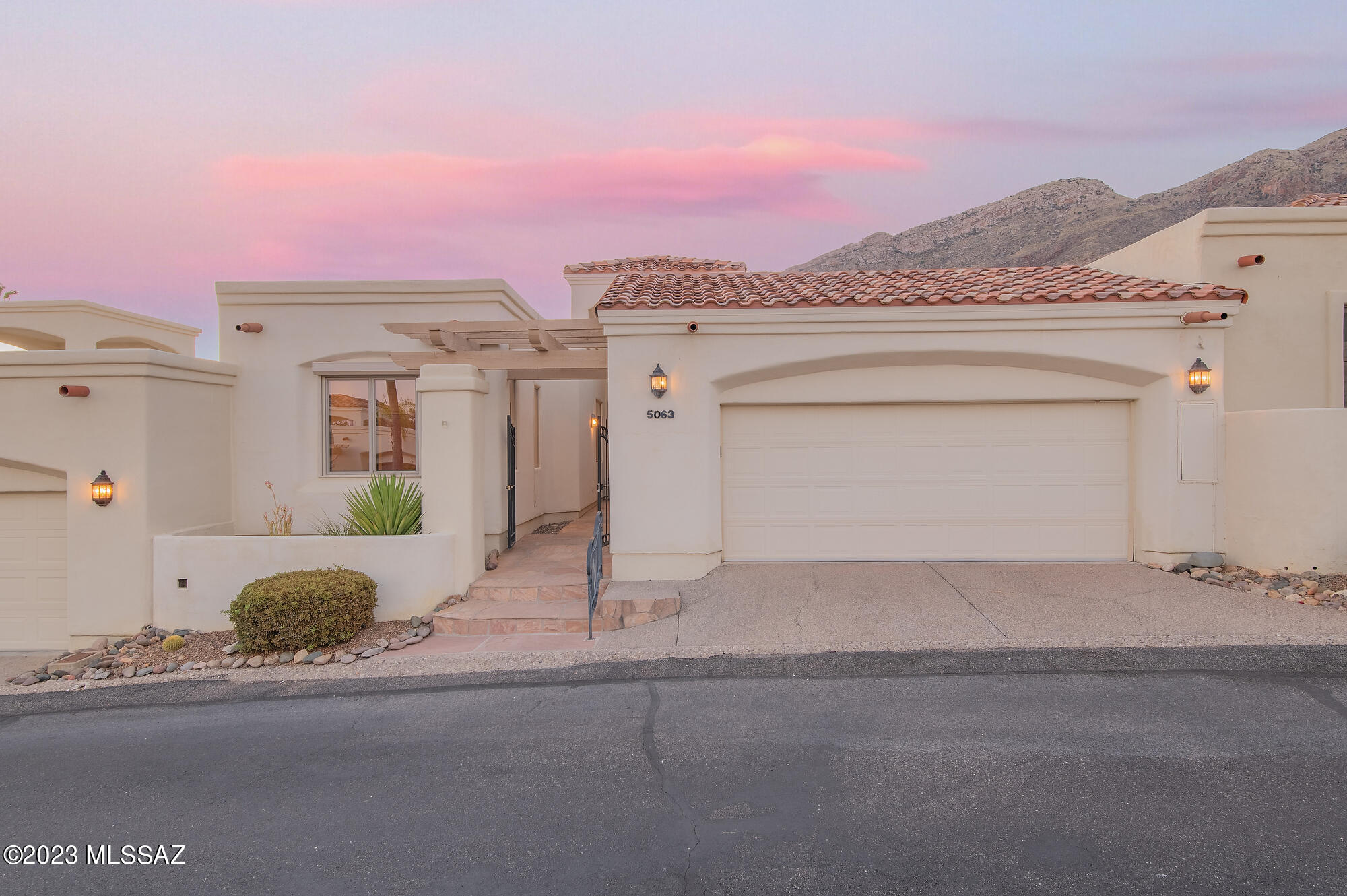 Located in the highly sought after resort community of Skyline Country Club and anchored by 24-hour guard gated security, this bright and airy residence offers 2,400 square feet with 3 bedrooms and 3 full baths. The spacious great room features lofty ceiling heights and floor to ceiling picture windows with views that stretch out over the greens of the 3rd Fairway and the Catalina Mountains beyond. A cozy fireplace adjoins the dining area, with the eat in kitchen complemented by warm wood tones creating comfortable interiors that flow together in a user-friendly open floor plan concept. The expansive kitchen features ample custom wood cabinetry, a built-in buffet and extensive countertop task space, with walls of windows that overlook the front entry courtyard. Relax in the sumptuous primary suite, which includes a large walk-in closet, shower and dual vanities. The secondary bedroom suites are spacious with generous closets and soft natural light. The North facing private rear courtyard, with a large covered patio seating area, is designed to extend square footage, blurring the distinction between indoor and outdoor spaces, and is perfect for entertaining, or simply enjoying the unobstructed Catalina Mountain views beyond.

About Skyline Country Club:
Tucked away in the heart of the Catalina Foothills, Skyline Country Club is a guard-gated golf community featuring a wide variety of housing options from condos to townhomes and estate homes. Within the confines of this gated community, residents enjoy exclusive, sought-after membership amenities, including a modern fitness center, tennis courts, swim pool, and access to the club's award-winning golf course. Impressive views of the Catalina Mountains, city lights and golf course greens are found at every turn.