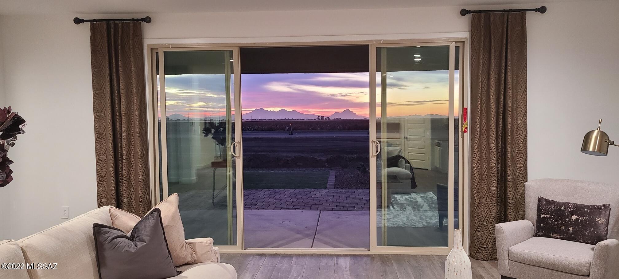 SLASHED PRICING! AND OMG, THE VIEWS!! On this fabulous lot with NO REAR NEIGHBORS, Sunsets and Sunrises from this South facing back yard, are going to be killer! Next to a common area too, only ONE neighbor, and right across the street from community walking path! Beautiful 4 bed  + Study 3 bath home with large home site and all the finishes included. Wood look plank tile everywhere but bedrooms & den, Silestone Cemento Quartz kitchen, white backsplash, executive height vanities with quartz Tops, beautiful White Shaker cabs, 4 1/4 base boards, all the latest in design. SS gas appliances with Gourmet Kitchen option (double oven) and much more. Nestled in a quite peaceful community only 2 minutes to the freeway. PLUS Beautiful Community Views of the Catalina Mountains!! Come take a look!