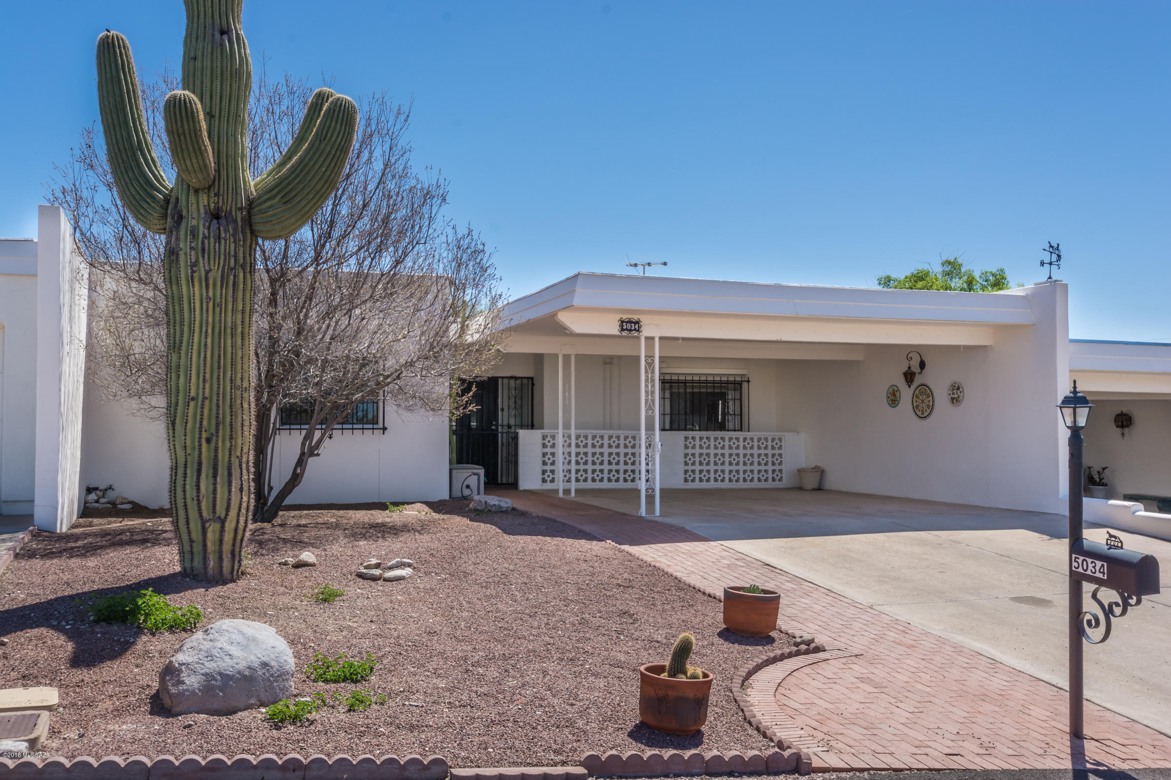 This super cute and clean townhome in highly desirable Northridge Estates is perfectly situated atop a ridge within the subdivision and backs up to open desert for added privacy.  This versatile split plan home features large den, spacious kitchen with tons of cabinetry, huge laundry room with extra storage, fully enclosed covered patio plus additional pavered patio area with attached storage shed.   Generous sized Master Suite with walk-in closet.   Murphy bed and built-in shelving in 2nd bdrm.  Fresh interior paint throughout!  3-year roof warranty.    Extremely well kept community with fabulous pool, recreation center and exercise facilities all nestled at the base of the foothills and super convenient to lots of terrific shopping and restaurants.