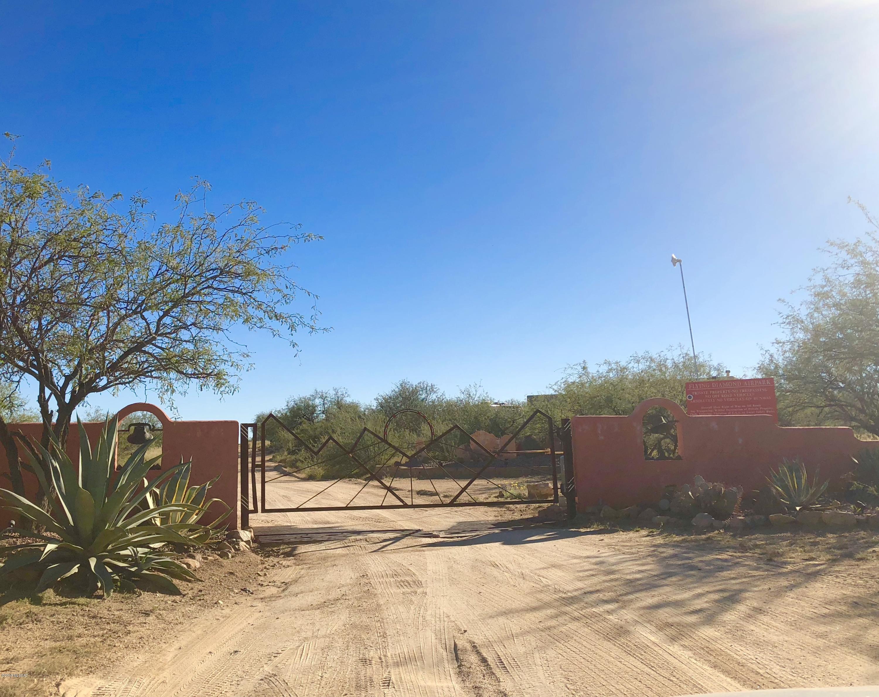 4.55 acres in the gated community of Flying Diamond Air Park. This lot offers a north facing back yard. Easy access to utilities. Septic tank already installed. Up to three horses allowed on this property. The community offers a private airstrip and is surrounded by state land.