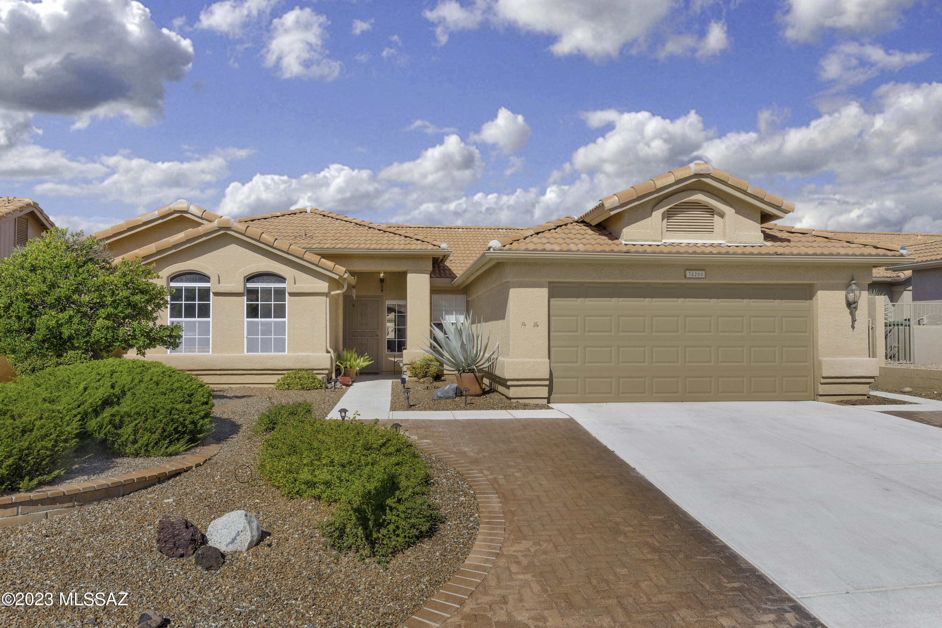 We're Proud to Present a Lovely Topaz with Private Yard & Mountain Views from Front Yard! Great Curb Appeal! Custom Entry Door that leads to Foyer. Living Room & Dining Room with wall of windows. Kitchen with Granite Counters, White Appliances, LED Lighting, abundance of cabinets, & kitchen dining area with desk. Family Room has Gas Fireplace & Patio door. Owner's Suite offers slider to Patio. Owner's Bathroom with tiled walk-in shower & walk-in closet. 2 Guest Bedrooms with closets & Bathroom near by. Spacious Laundry Room has W/D, desk, & storage. 2022 Roof Underlayment Replaced & Exterior Painted. 2 Car Garage with W/H, newer HVAC, cabinets & water softener loop. Covered Patio & extended paver Patio. Fruit Trees, raised flower beds, artificial grass, serene landscaping & gated yard.