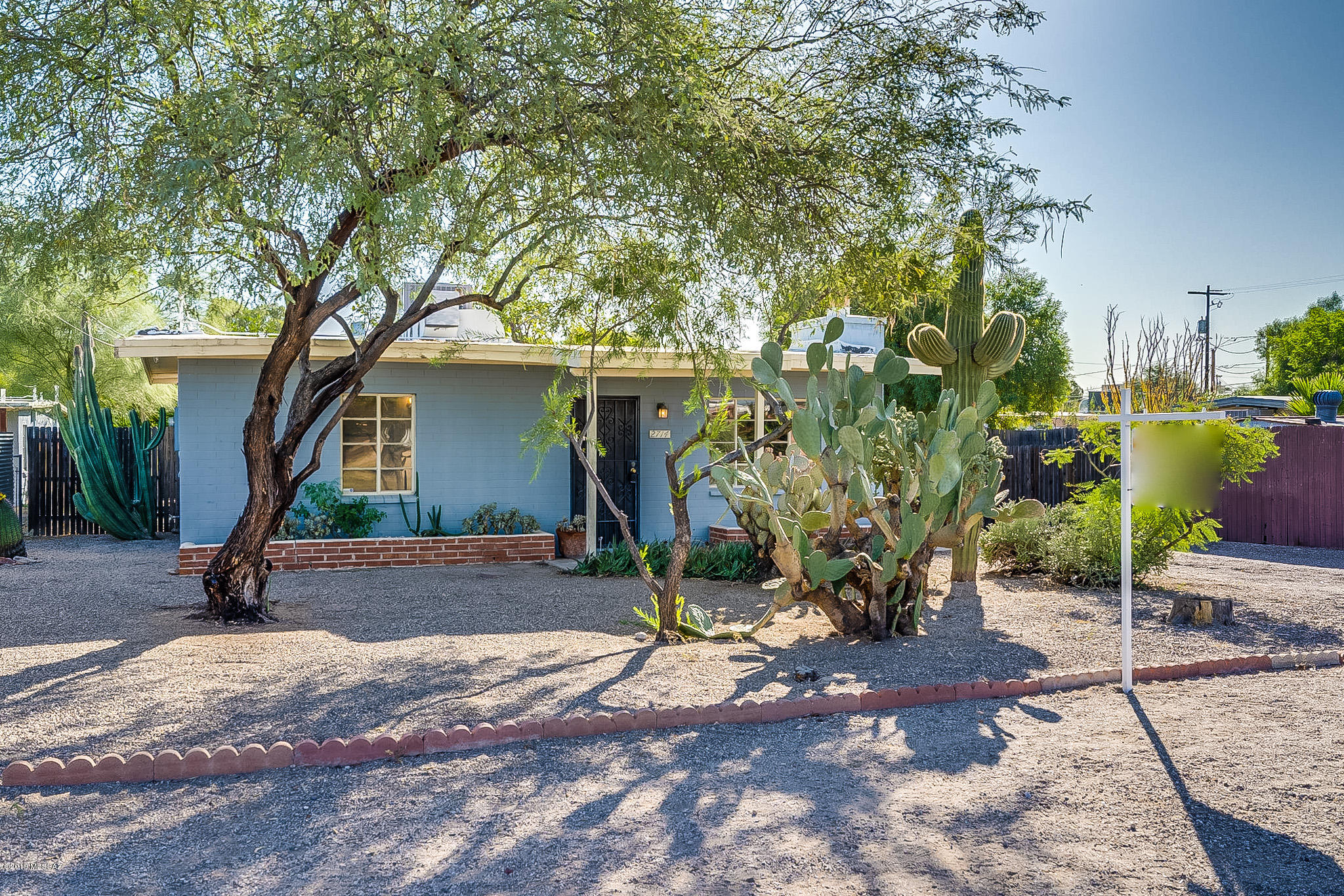 Don't miss this charming single -story 2 bedrooms, 1 bath home. If you are looking for a home with a large, fenced yard, a detached garage/workshop and plenty of room for parking, this home is for you. It has newer AC, exposed wood beams, updated kitchen, walk in shower, wood burning fireplace and gas stove.  The front-loading washer/dryer in the laundry room is accessible from outside. ADT alarm system is pre-wired. It has 3 citrus trees, a pomegranate and fig plant in the back yard.
A block from Helen Keeling Elementary School and conveniently located to restaurants and shopping.