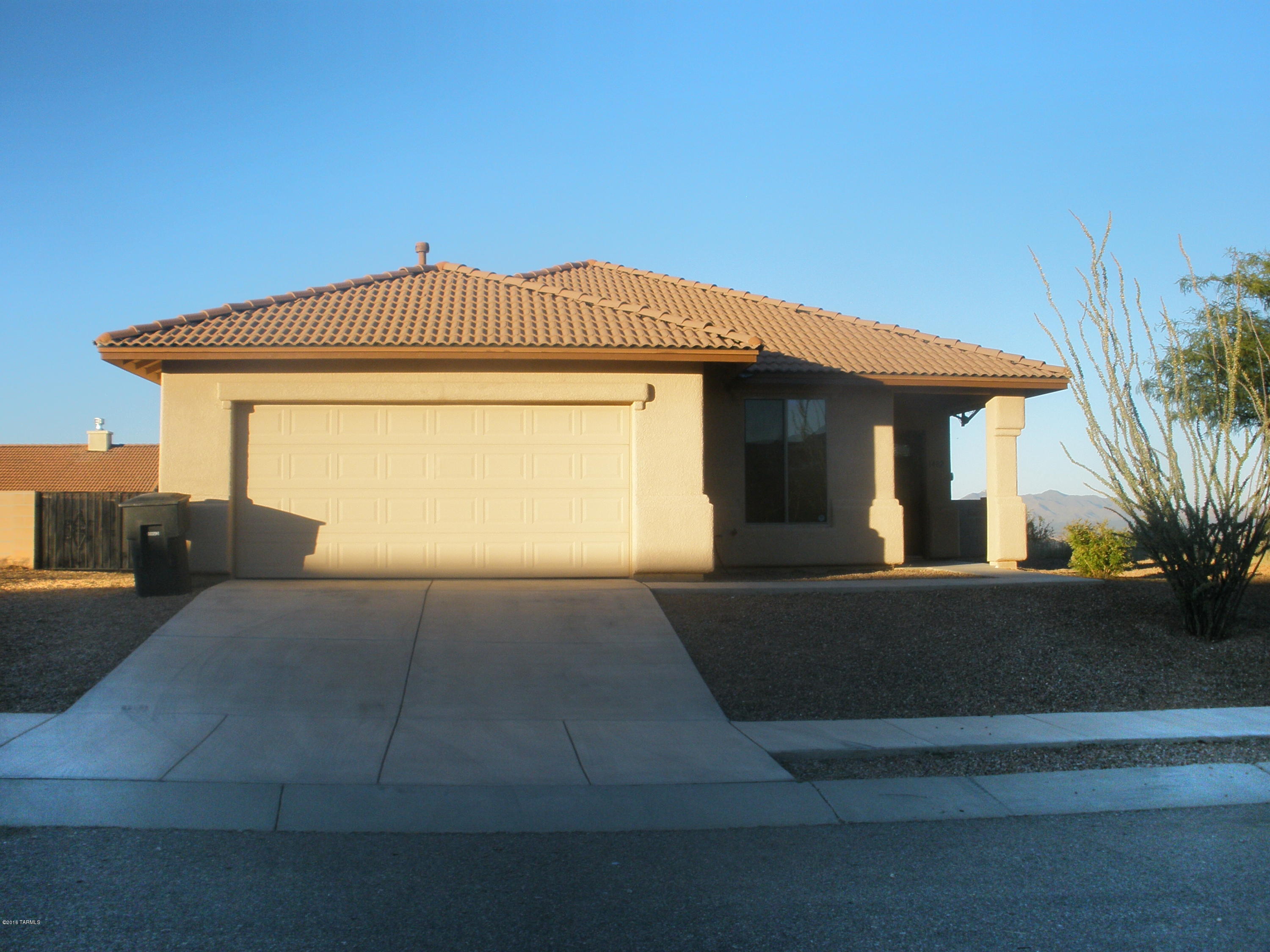 Beautiful home on Premium lot offers four roomy bedrooms, ceiling fans throughout, 18' ceramic tile, granite kitchen counters, dual sinks in luxurious master bath, expanded two car garage, and FABULOUS VIEWS TOO!  Freshly painted interior. Block fencing with two wrought iron gates including an RV driving gate. Energy package insulation upgrades, dual pane windows, brushed stainless steel kitchen appliances.  Large covered rear patio, perfect for enjoying your favorite beverage and INCREDIBLE VIEWS!!