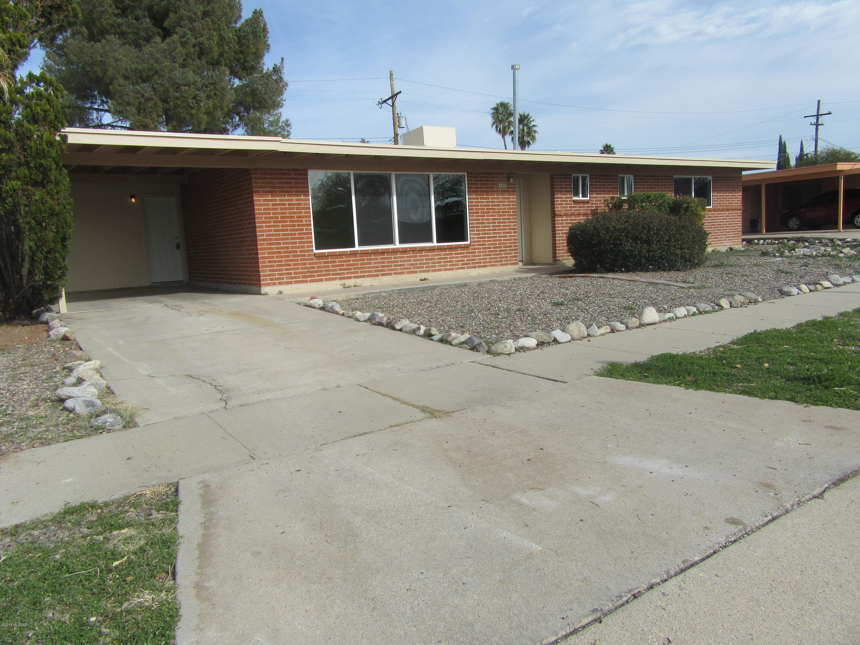 Wonderful home with new windows, new flooring, new dishwasher, tile counter tops in kitchen and hall bath, new roof coating!  Separate living room plus a bonus room.
Large back yard!