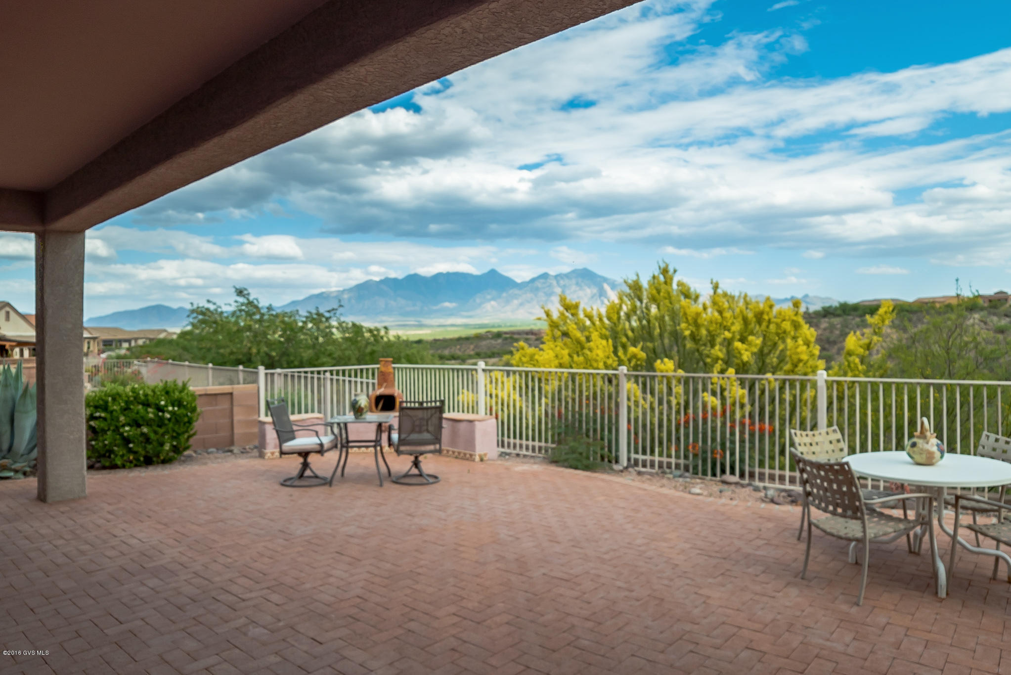 If an unobstructed, panoramic mountain view is what you are looking for then this is the house for you! Enter into the foyer and your eyes will immediately notice the incredible views from high above the Canoa Ranch Golf Course. An open floor plan with a spacious kitchen complete with center island also features new range/oven, microwave and refrigerator. Enter through double doors into a large master suite with separate vanities in bath, separate tub and shower, and a huge walk-in closet! You will enjoy a terrific brick patio to enjoy beautiful sunsets and star filled skies!!