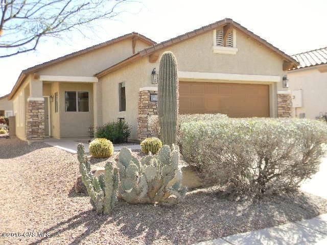 Living is easy in this home in the popular 55+ active adult community in Rancho Sahuarita. The perfect size for retirees with plenty of entertaining space in the large eat in-kitchen. Upgraded 18'' tile, everywhere except the bedrooms, executive height sinks, a walk in shower and expansive closets make this home feel spacious! Stepping outside you'll find a covered back porch with extended brick pavers, perfect for enjoying a cup of morning coffee outside in the AZ weather! This home comes fully furnished, so just bring your toothbrush and move right in!