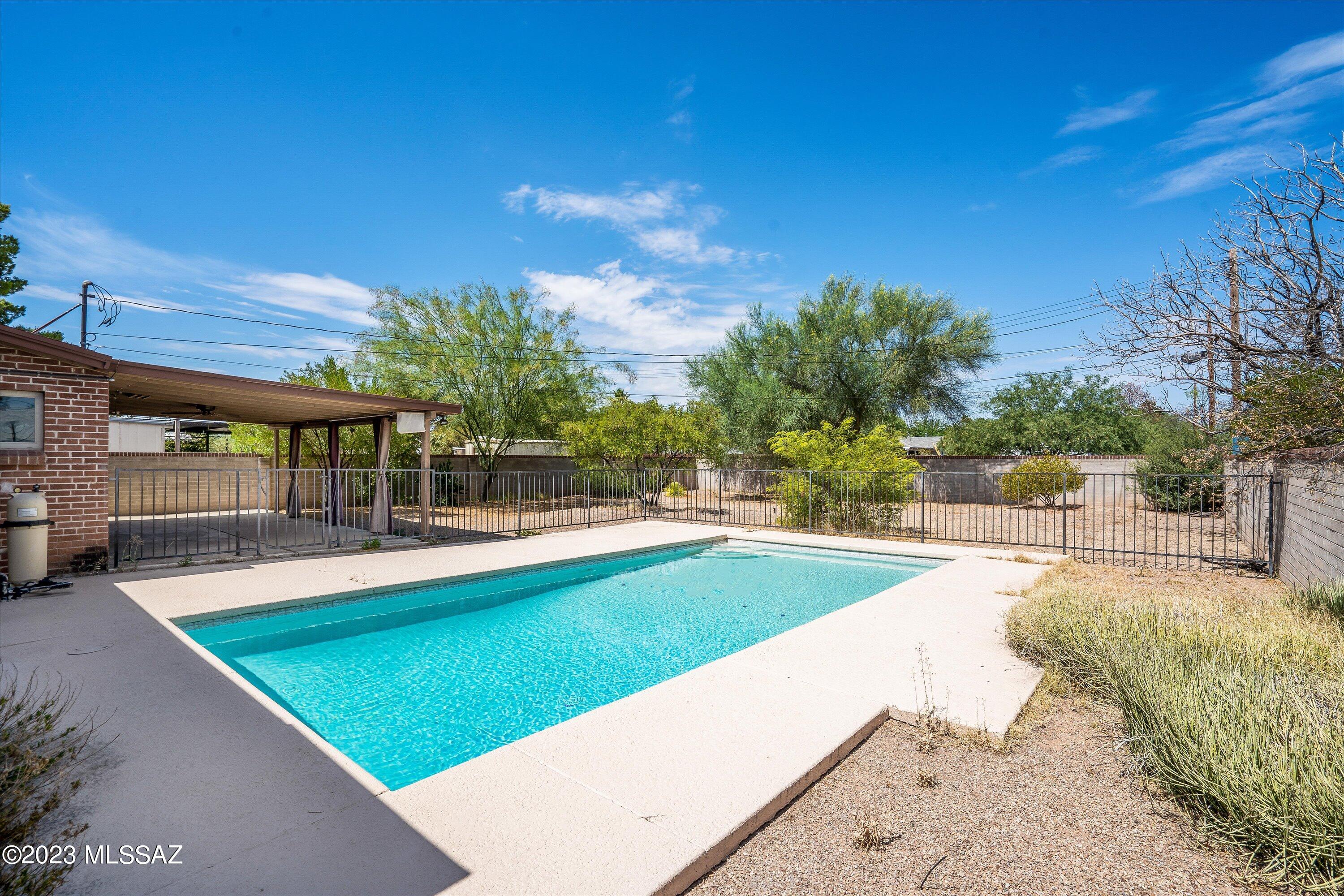 ADORABLE CENTRAL BRICK HOME WITH POOL.  3 BEDROOM, 1 BATH, DESIRABLE CENTRAL NEIGHBORHOOD. THIS HOME FEATURES,16 x 16 TILE IN ALL LIVING AREAS, UPDATED KITCHEN, GRANITE COUNTERTOPS, BLACK APPLIANCES,  NEW CARPET IN BEDROOMS, FRESHLY PAINTED, BATHROOM WITH DOUBLE SINKS, GRANITE COUNTERTOP, UPGRADED LIGHTING, HUGE LAUNDRY ROOM WITH EXTRA STORAGE, GARAGE, ROOM FOR A RV, LARGE COVERED PATIO, SPACIOUS YARD. THIS HOME IS  PERFECT FOR FIRST TIME BUYER, SECOND HOME, OR RENTAL.  MOVE IN CONDITION. CLOSE TO SHOPPING AND BIKE/WALKING TRAILS.
