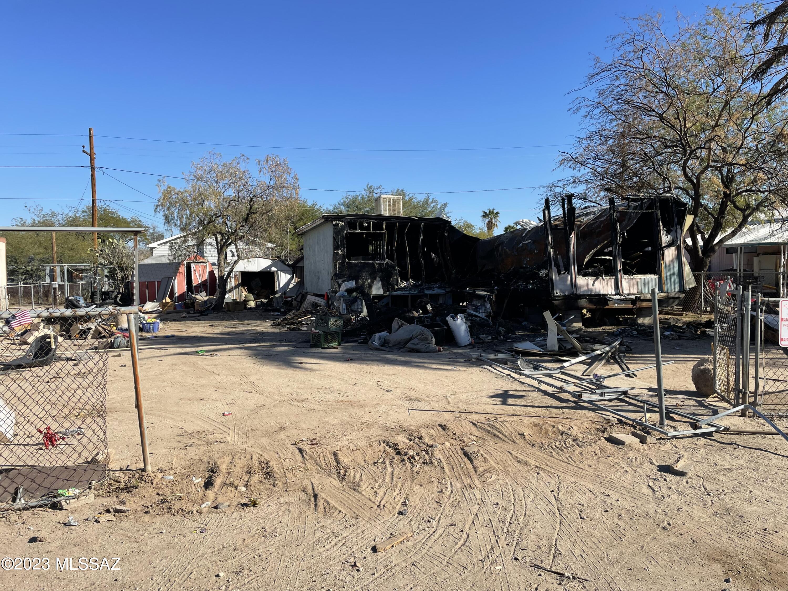 Mobile Home Lot.  Zoned Tucson MU. 6229 sq-ft. Lot to be sold As-Is. Seller will not clean-up, remove damaged mobile home or personal property. No Warranties expressed or implied. Buyer to do their due diligence. 
Cash Only.