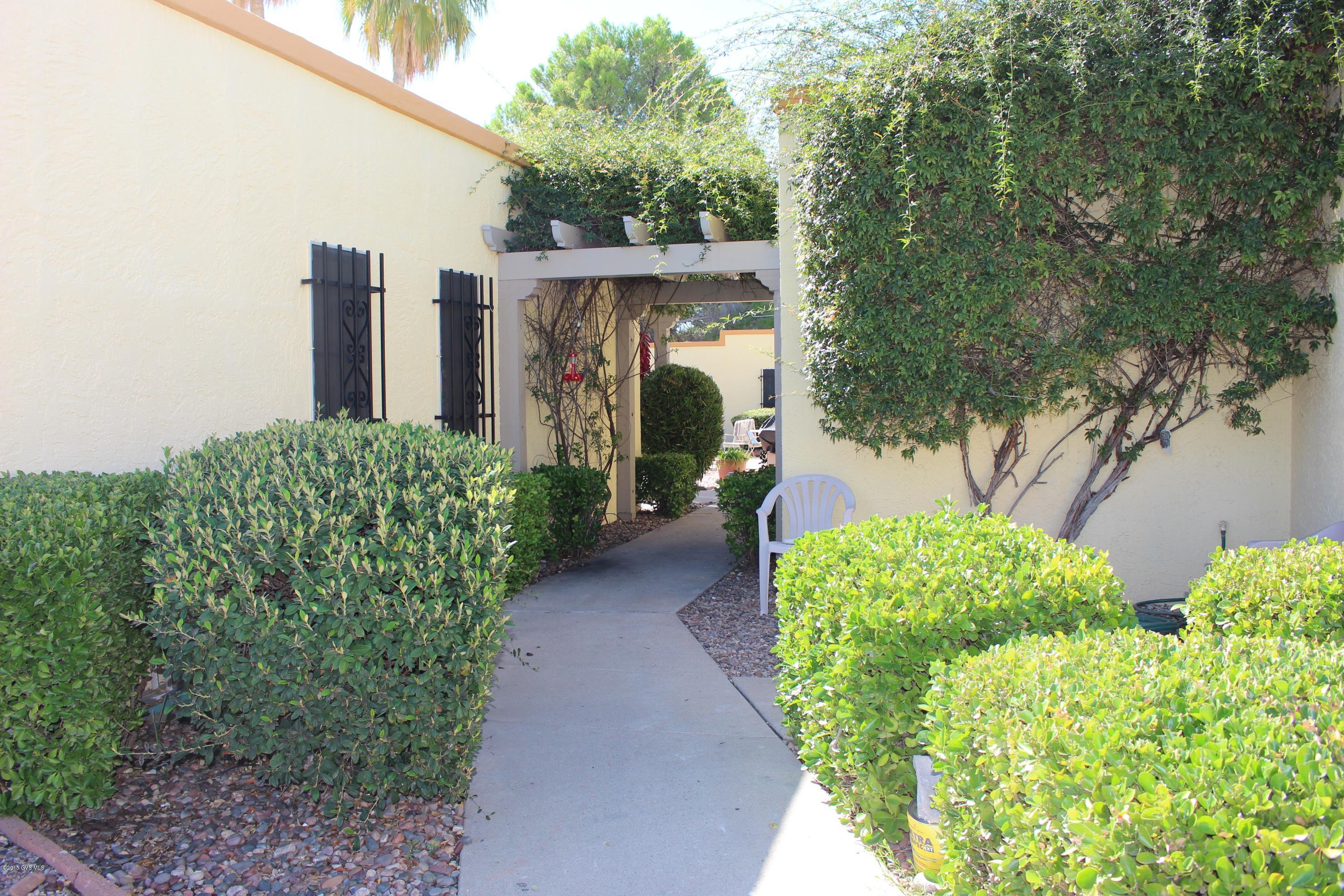 This home is a 1 Bedroom Resort home located in the heart of Green Valley. Inside you'll find a bright and cheery space, new tile floors in kitchen and bath, carpet in the Living and Bedroom Areas, recently painted in neutral colors, and a newer refrigerator, and washer/dryer unit. Outside your front door is a large community patio which is maintained by the HOA; here you can sit in the shade, barbeque, socialize, or just sip a cool drink and enjoy the Arizona sunshine. You'll also appreciate the proximity of this unit to the Community Pool and Spa. The Continental Shopping Plaza, with a grocery store, unique shops, and a variety of restaurants, is a short 5-minute walk away. As a Green Valley Recreation (GVR) member, you'll have access to all of the 13 GVR facilities, one of which  is conveniently located just across the street. GVR facilities have pools, spas, tennis courts, exercise rooms and offer activities such as movies, dancing, concerts, woodworking, jewelry making, as well as over 400 clubs to belong to. A lot of fun times and memories await you!