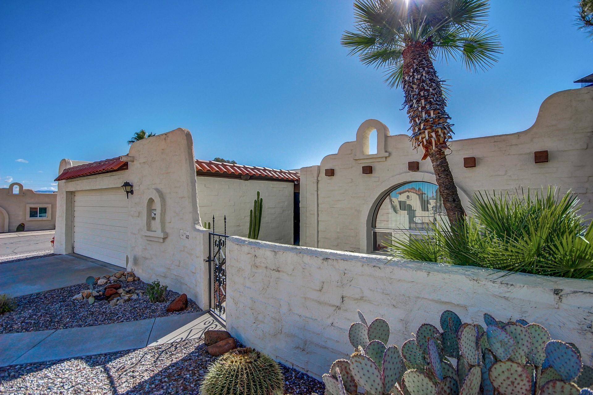 Your own private oasis awaits you in this lovely townhouse on a corner lot. Recently remodeled with new bathroom vanities, shower, mirrors, countertops and kitchen updates, this home with wood-burning fireplace is comfortable, inviting and fully furnished, it makes a great winter retreat! Extremely well-maintained and cared for, your winters will be spent enjoying Southern AZ with warm afternoons on the extended patio under the ramada. The office looks out to the backyard and there's even a partial mountain view. Pick oranges from the fruit tree for fresh juice in the mornings. And know that you won't be worrying about fixing up the house!