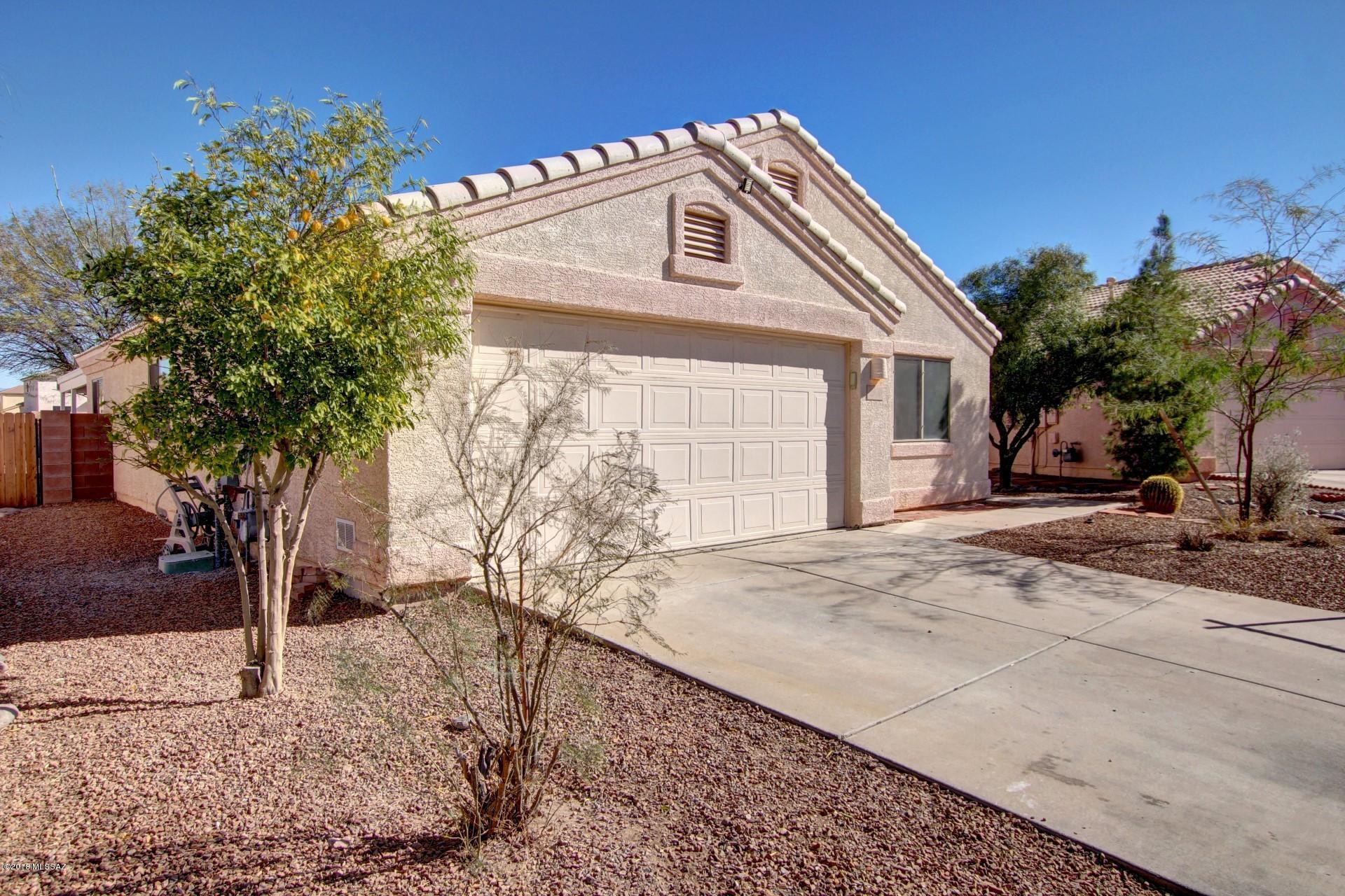 Great home in a great location. This 3 bedroom 2 bath split plan with great room open to the den, newly painted inside including tille roof and 2-car garage. You will love the wrap-around covered patio with no one behind you. Close to downtown, shopping and quick access to I-10.