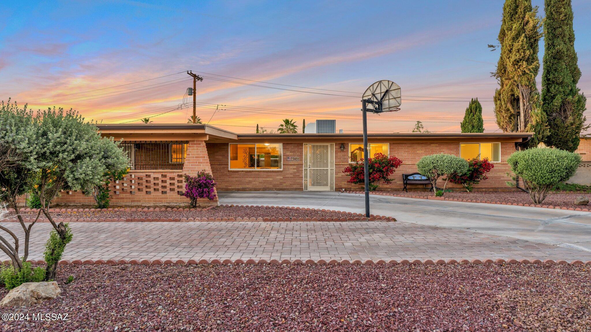 Fantastic opportunity to own a superbly maintained 1,716 sq ft, 4 bedroom, 2 bath home in East Tucson. This home exudes pride of ownership and the love for this home is evident in every detail. Home has ceramic tile and wood laminate throughout, a modern and updated kitchen with all stainless steel appliances and granite countertops and both bathrooms have been updated with lovely finishing touches. The fantastic backyard boasts a beautiful garden, meticulous paver work and several varieties of mature fruit trees...apple, peach, cherry, grapes, trebizond date and pomegranate AND it has mountain views. Your own oasis in Tucson.  This home is a pristine paradise, a hidden gem with extraordinary curb appeal. Come and join us at our open house either Friday May 3rd, Saturday May 4th or Sunday May 5th so you can see this one-of-a-kind home in person. No showings before open house.