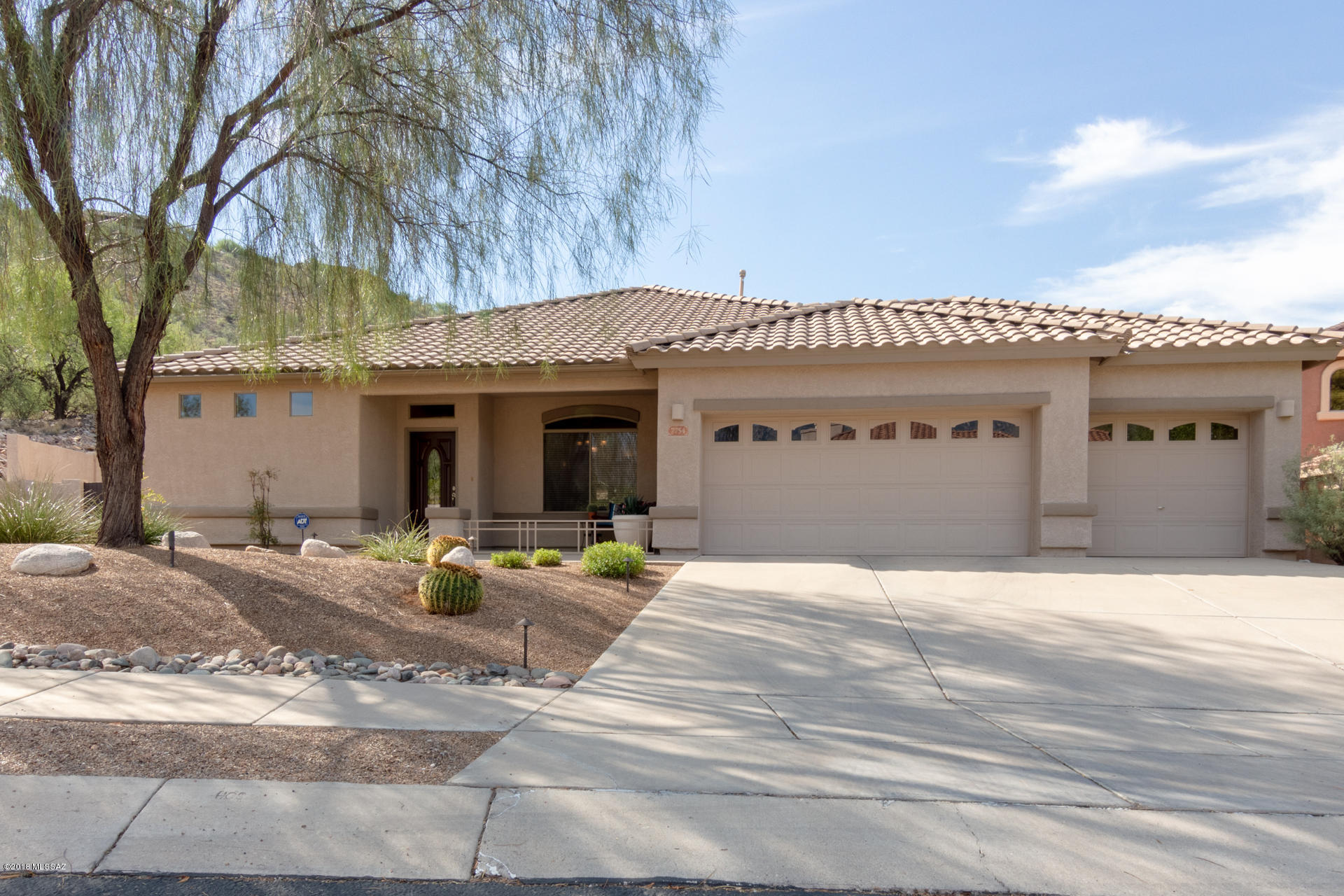 Lovely one level 2379 SF updated 3 bedroom  home in desirable gated Shadows at Sabino neighborhood. Expanded model with large master bedroom including second fireplace, large soaking tub, double sinks, quartz tops and separate shower in recently remodeled master bath. Upgraded patio with large shaded area, built in BBQ, lap pool, Kiva fireplace and professional putting green. Recently remodeled bathrooms with Quartz counters and custom mirrors. Large walk in Refrigerated Wine Cellar for the enthusiast, 3 car garage, beautiful built ins at third bedroom/office. Open plan kitchen with stainless appliances and granite tops.  Shopping and dining nearby including Sabino Canyon Rec. area for hiking and biking.