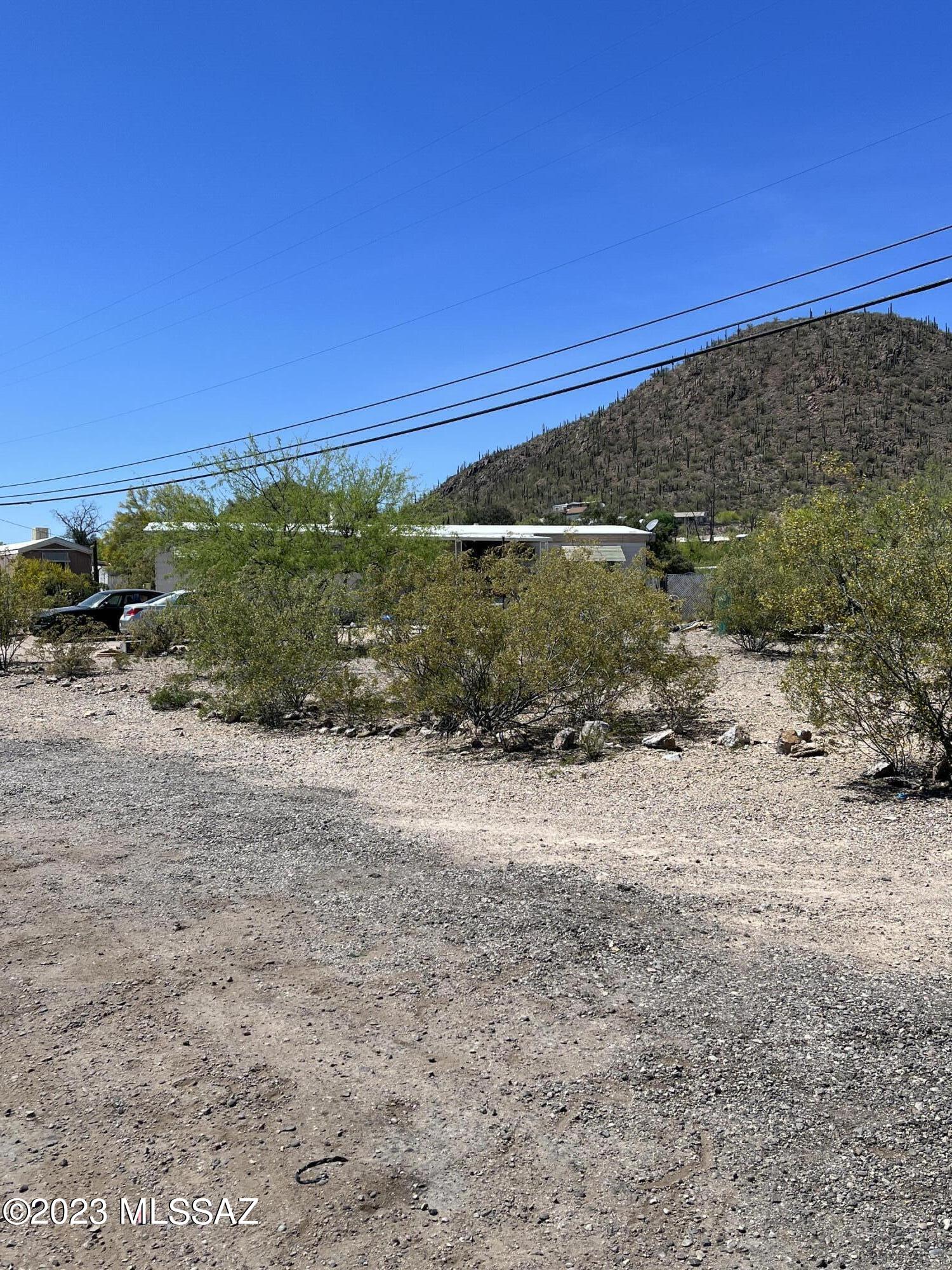 40,641 sqft/0.933 acres of land for sale. This property presents an opportunity for buyers seeking land that produces income. The land currently houses two mobile homes, which are not included in the sale. These mobile homes lease the land for  $325 per month each, resulting in a total monthly rental income of $650. Each mobile home has separate water meters, electric connections, gas lines, and other utilities. the mobile home owners are responsible for paying the associated utility costs. The property features two septic tanks, one designated for each mobile home.
