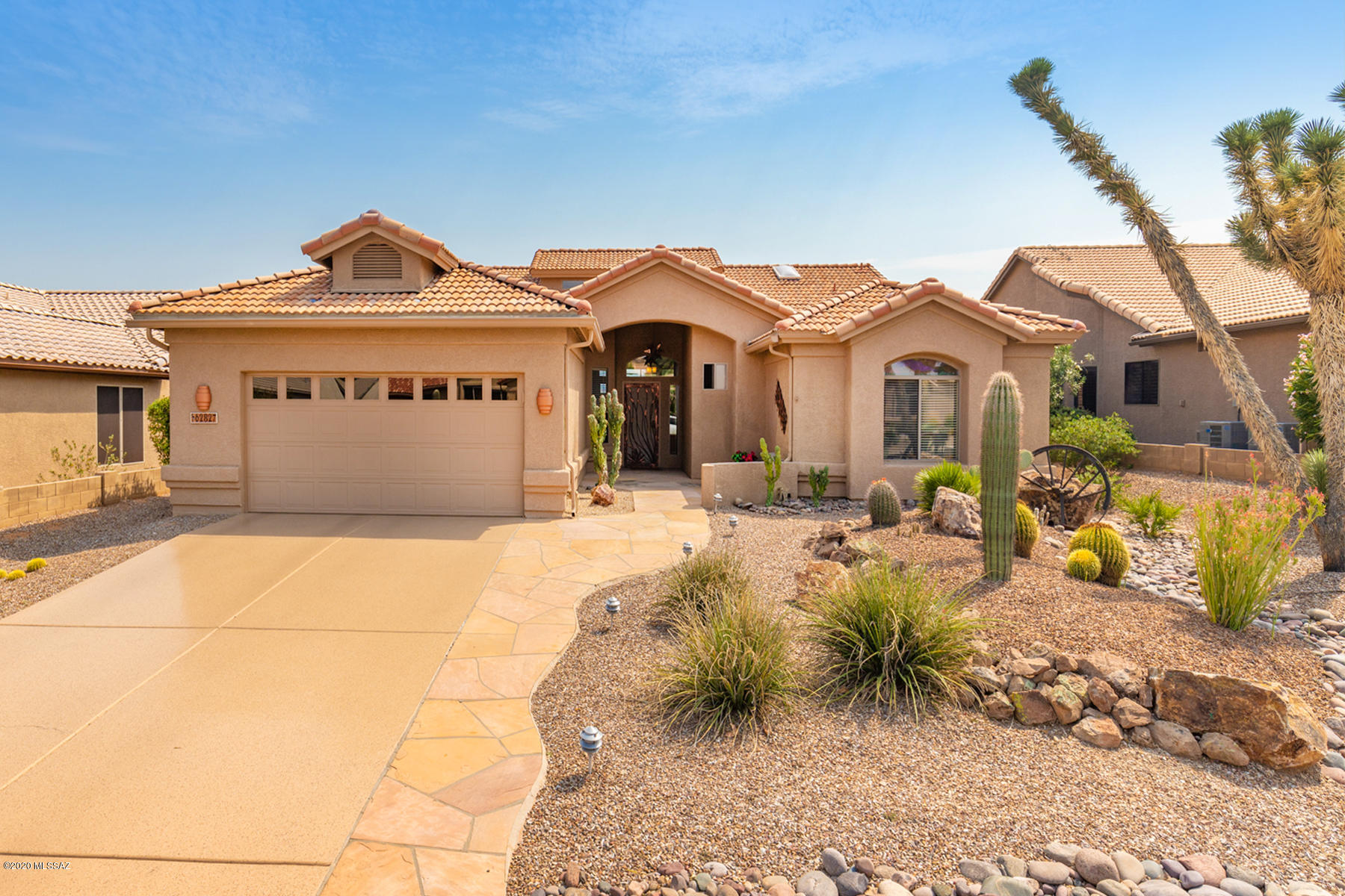 Luxurious 3BD/2BA (2,387 sq ft) Estancia plan boasts an Arizona room, updated baths plus panoramic Catalina views. Flagstone entry flows to a formal living room w/vaulted ceiling, dining room w/archways and Great room boasting view windows and breakfast nook w/bay window. Chef's kitchen flaunts granite countertops & island, sleek black appliances, built-in desk. Elegant Master suite hosts dual vessel sinks, tiled walk-in shower plus walk-in closet. Large laundry room w/ample storage. Extended 2-car garage w/built-in cabinets & utility sink. Professionally landscaped yard boasts flagstone pavers, newer irrigation system and mesmerizing views. SaddleBrooke is Tucson's Premier Active Adult Community with clubhouse, pool, golf-tennis-pickleball and Performing Arts Center. See 3D Tour online!