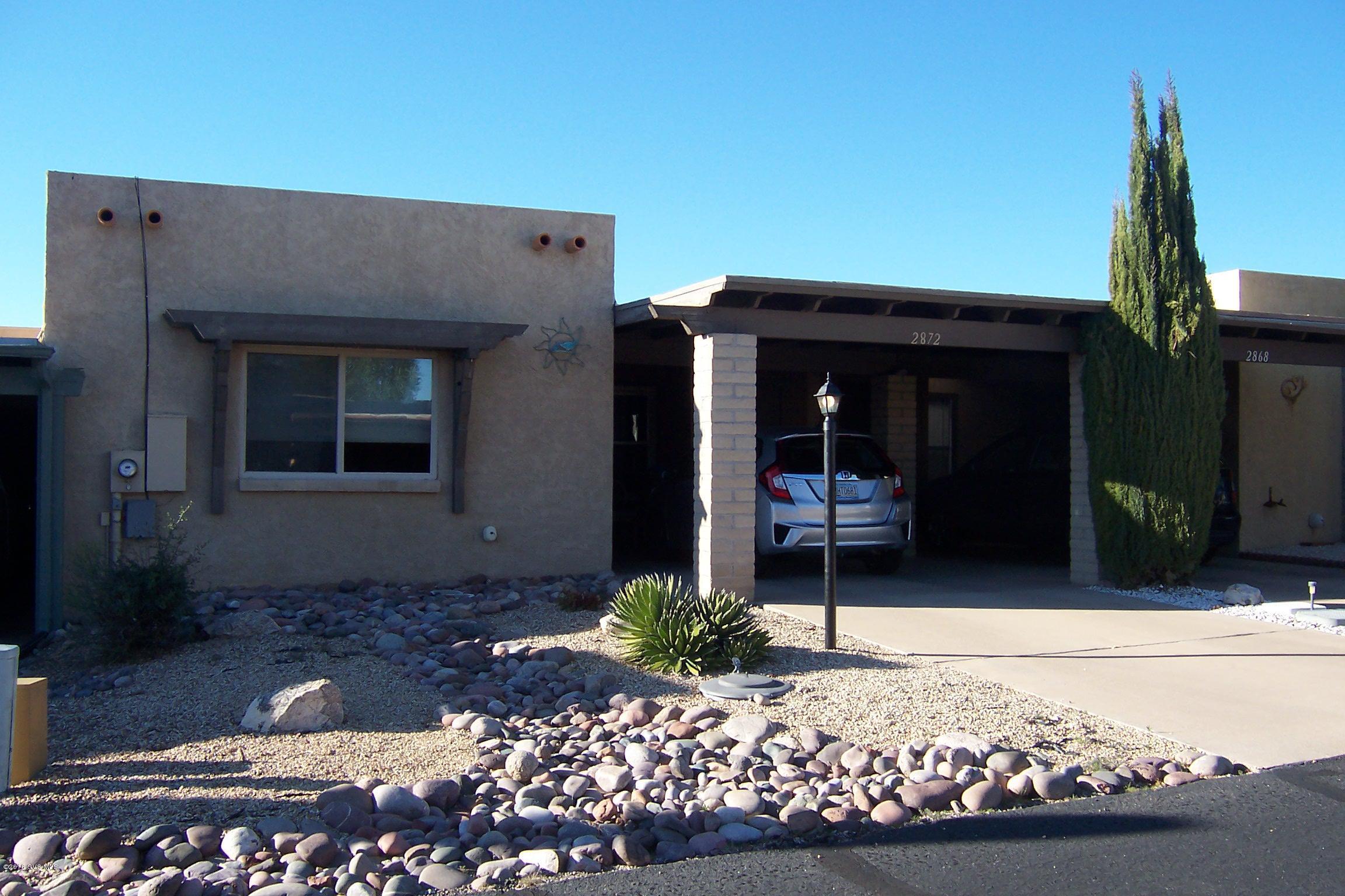 Terrific price for this furnished townhome (owner even including a computer) located on quiet cul-de-sac. You can view the Santa Ritas through the oversized front window. Carpeting in living/dining area and bedrooms. Tile floors in bathrooms. Master bath has large glass enclosed shower. Guest bath has shower/tub combo. A little creative touch will make this townhome an ideal winter retreat. Private, covered patio in enclosed yard. Storage off carport and back patio. Newer windows, Newer light fixtures. New Carrier A/C & heating system June 2013. (Service contract on system through June 2017). New GE electric range March 2015. New electric water heater December 2013. HOA $389 annually.