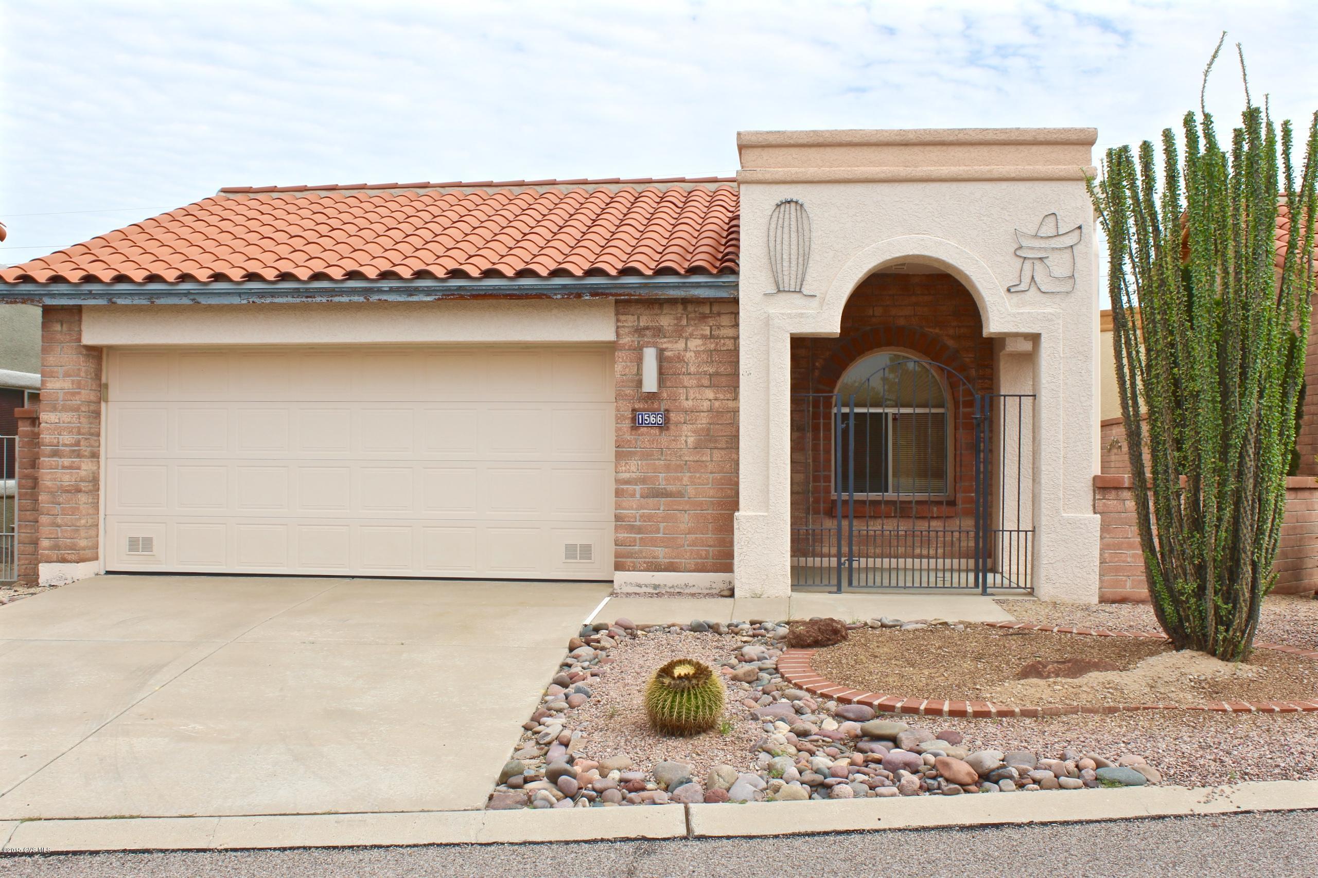 You have found the perfect home to make into a hobby! You'll enjoy making this charming, cozy, townhouse your own with all the possibilities of new designs and decor available!! Popular Mariposa floor plan lets you enjoy the views from the front and back of the house. A beautiful home with mature landscaping and lovely curb appeal. The 2 1/2 car garage offers extra cabinets, a work shop and space for a golf cart or motorcycle. Mexican Saltillo flooring in the kitchen and breakfast nook, built in cabinet in formal dining, 3 bd/2bath, covered back patio with tile. Skylights to bring in extra natural light. Offered ''AS IS''. Don't let this opportunity slip by, come take a look right away.
