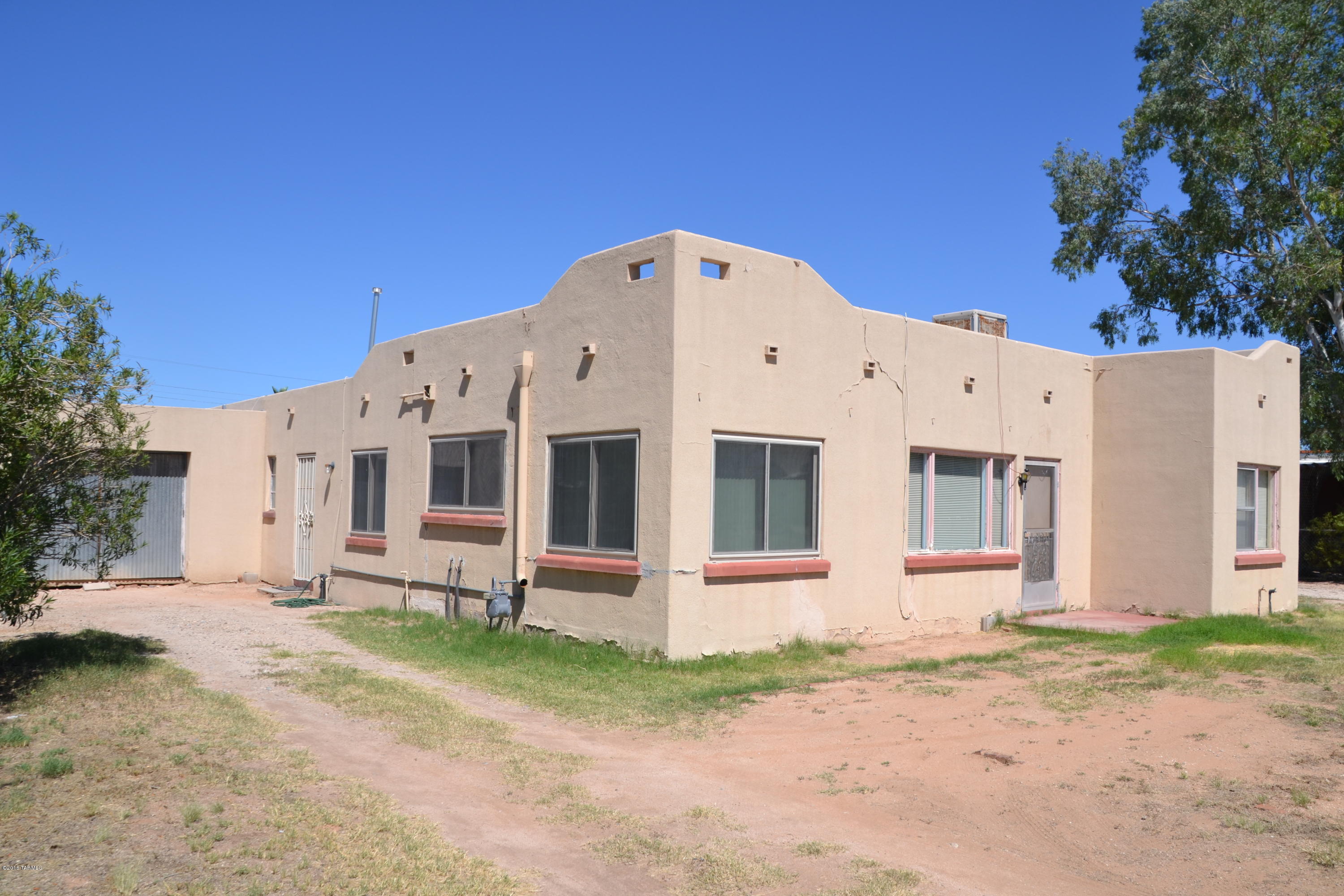 Great Location, Investment Opportunity. Huge lot zoned R-2. 3 bedroom 2 bath home with den/office and guest suite. Close to U of A, no HOA! Come see the potential.