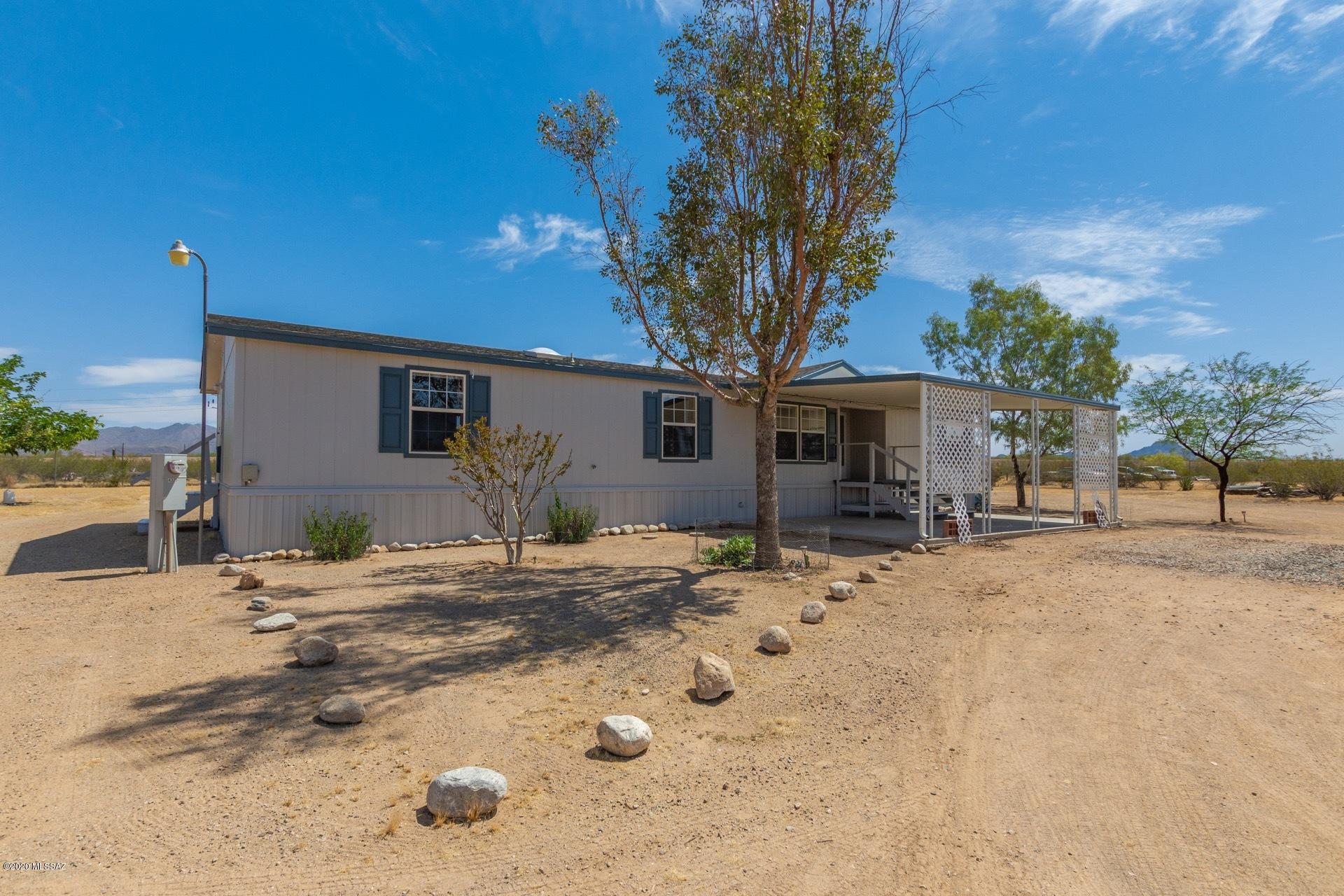 Views and solitude! Beautifully maintained manufactured home on a secluded lot. Sunset, sunrise, mountain views. New roof put on in 2019. Ceiling fans in every bedroom. Porch and patio were redone recently. Painted recently. Newer appliances in kitchen are included. Wood burning fireplace. 100% fenced yard. Borders public land. Mature fruit bearing apple and pear trees in backyard on drip irrigation system. Horse property. Large storage shed included. Don't miss out. This is a wonderful property.