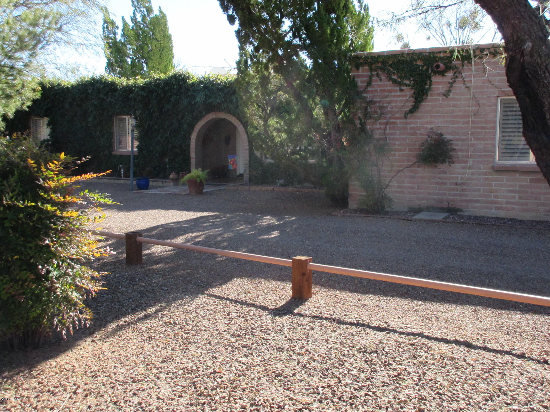 This warm and inviting 3 bedroom, 2 bath home sits on a corner lot in the Tubac Valley Country Club Estates. [] The living room has built-in bookcases, a beehive fireplace and opens to a sunny and enclosed Arizona room.[] The bright kitchen features state-of-the-art appliances and the master bath has a walk-in shower.[] This beautifully maintained home with pool and mountain views is move-in ready and waiting for you.