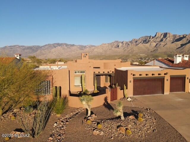 FULLY FURNISHED VACATION RENTAL!!! Rates based on length of stay, availability, and season. Monthly minimum stays only. Utilities included in stays less than 12 months.

This is the perfect property for an executive looking to relocate, a family building a home or travelers looking to take in the panoramic views of the Catalina Mountains in the heart of Oro Valley. This home has two beds in each of the 4 bedrooms and 3 full bathrooms plus a great room, TV room, dining room and laundry room fully equipped with all cleaning supplies to last your extended stay here. The pictures will never live up here! The Lynx grill, outdoor wood burning fireplace, large table and comfortable seating make this the ideal Tucson area home for every type of traveler's requirements.