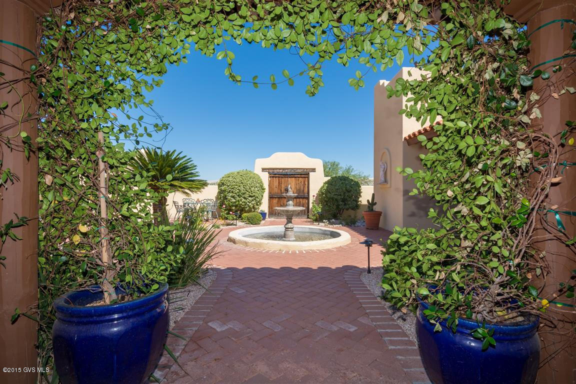 New Price! Hacienda living at it's very finest: beautifully updated and private (only 1/2 mile on dirt road). Enter into the courtyard through the wooden gates to find a peaceful setting complete with a bubbling fountain. A jasmine covered archway leads you into the home to find Saltillo tile floors, remodeled kitchen, stainless steel appliances, beautiful built-in cabinets and library shelves, and a new master suite wing completed in 2012 by Gary Cooper (S & S Construction). CHARM GALORE!!! In the backyard you will find a beautiful professionally landscaped setting and pool (2013). Beyond the pool, still within the fenced Hacienda you will find an art studio/office/man cave, whatever your needs are. Views from house & yard are incredible! Picture yourself sitting in this  gorgeous, private Hacienda gazing at the desert tranquility in the foreground of your own 2 acres and the unobstructed Santa Rita Mountains in the background. Home sweet Hacienda!|\n||\n|